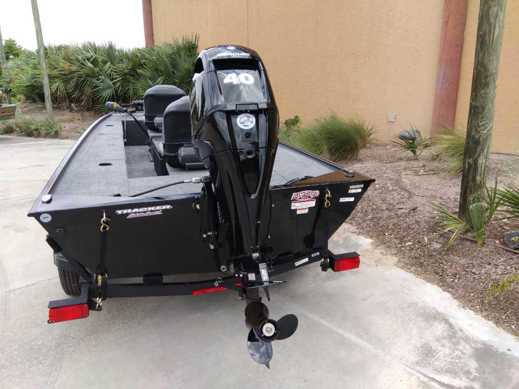 2025 Tracker Panfish 17 boat with Mercury 40 engine, parked outdoors.