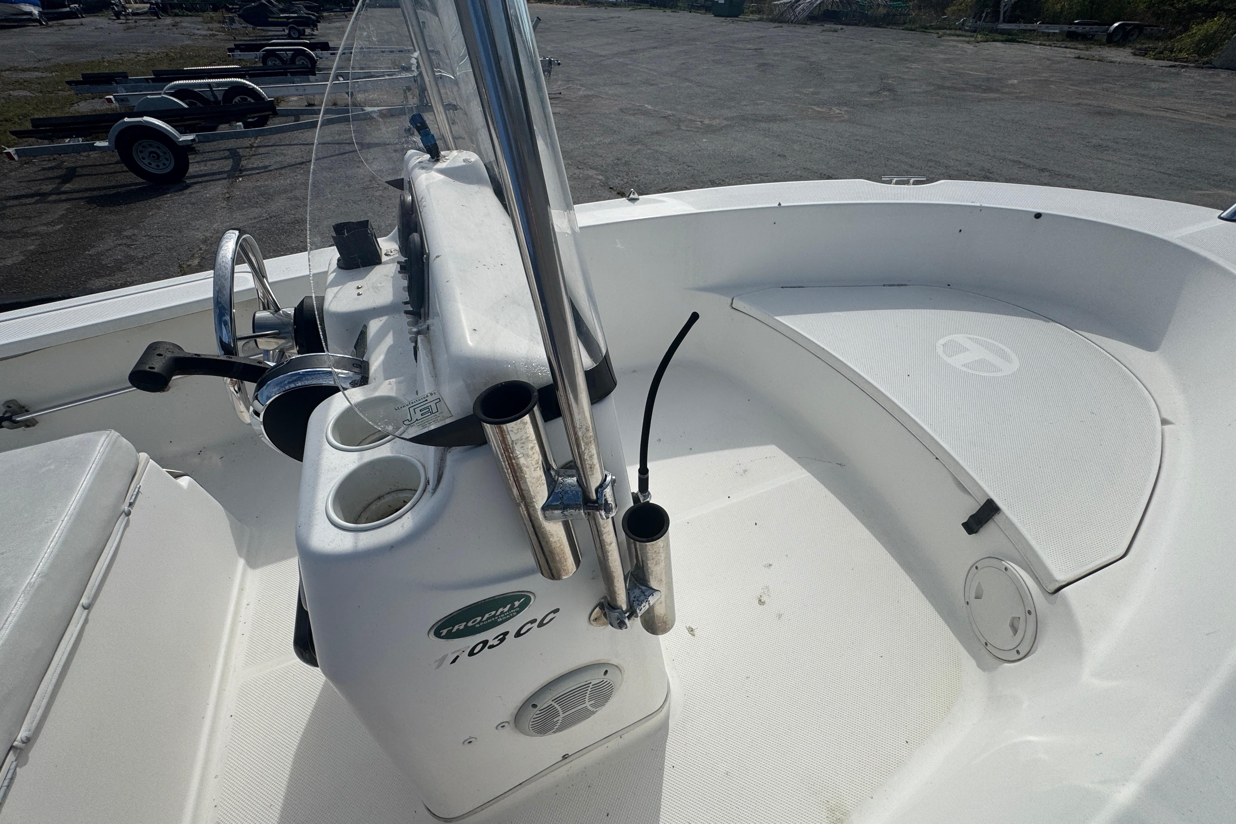 2007 Trophy 1703 Center Console boat interior with steering wheel and seating area.