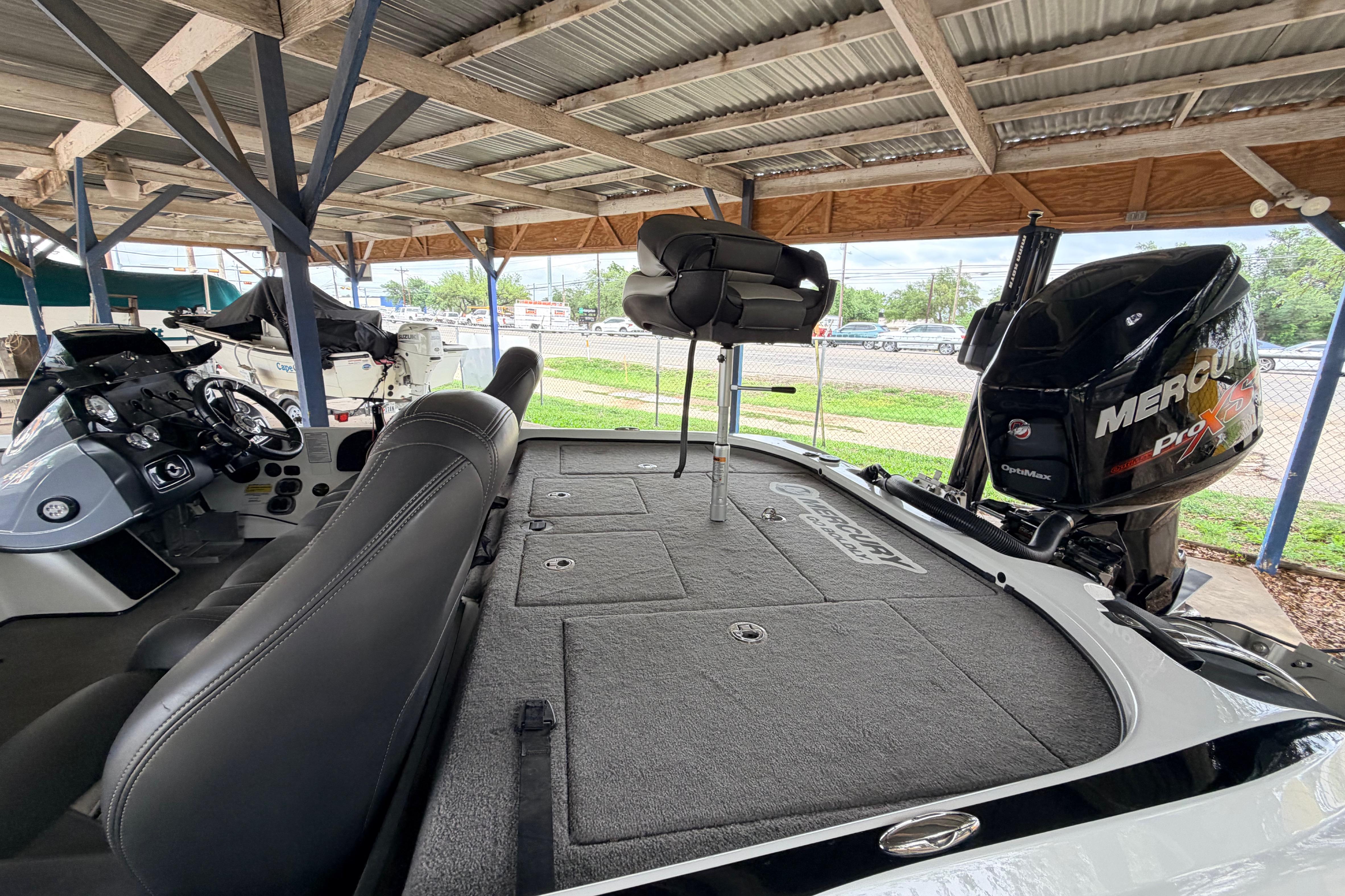 2016 Nitro Z20 boat with Mercury Pro XS engine under a metal canopy.