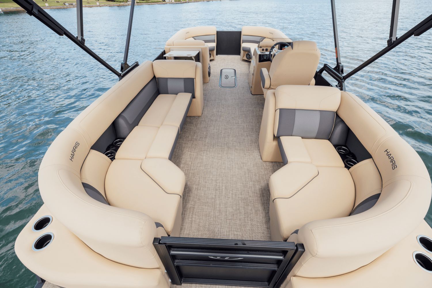 Harris Cruiser 230 pontoon boat with beige seating on calm water.