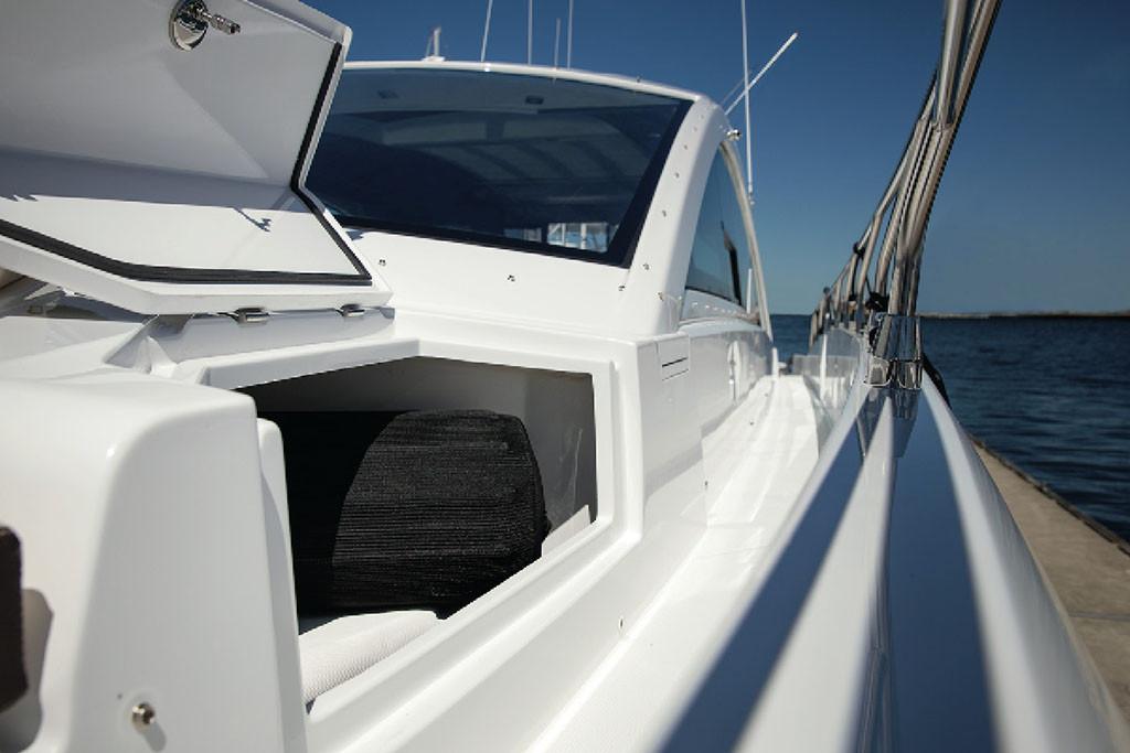 Manufacturer Provided Image: 2022 Cruisers Yachts 60 Cantius side view with open storage compartment.