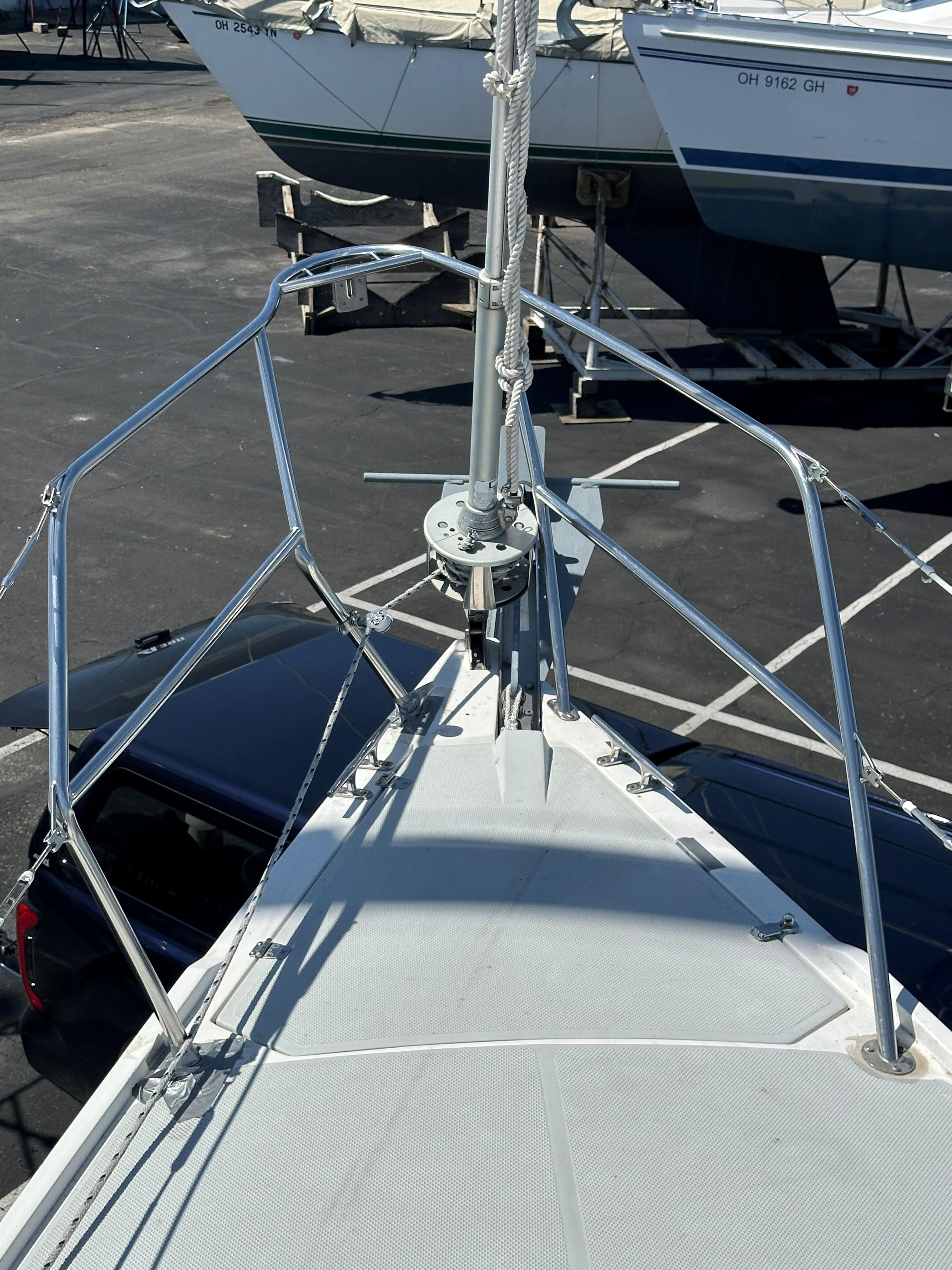 Foredeck of a Catalina 320 with stainless steel railing and windlass.