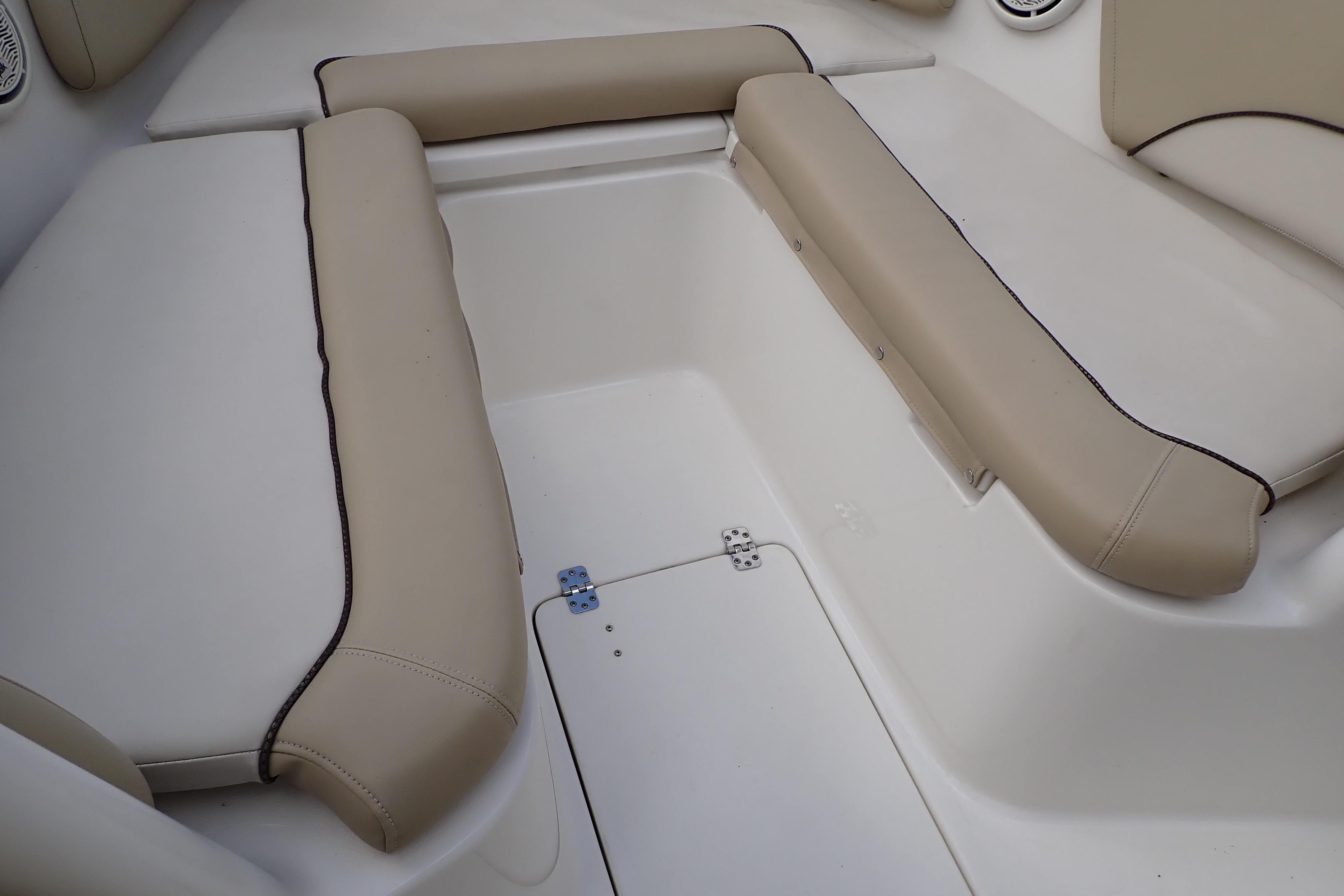 2019 Key West 263 FS boat interior with beige cushioned seating.