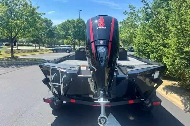 2026 Ranger RT198P boat with 150 horsepower engine, parked outdoors on a sunny day.
