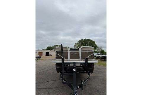2022 SUNTRACKER Party Barge 22 pontoon boat on trailer, parked outdoors.