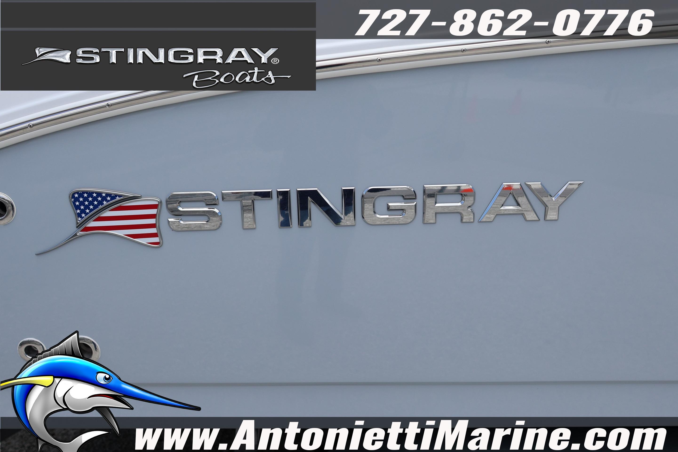 2026 Stingray 253 CC boat logo with American flag design and contact details.