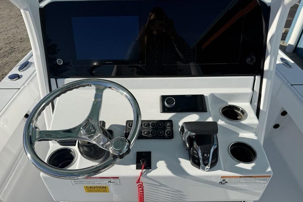 2026 Sportsman Masters 247OE Bay Boat dashboard with steering wheel and controls.