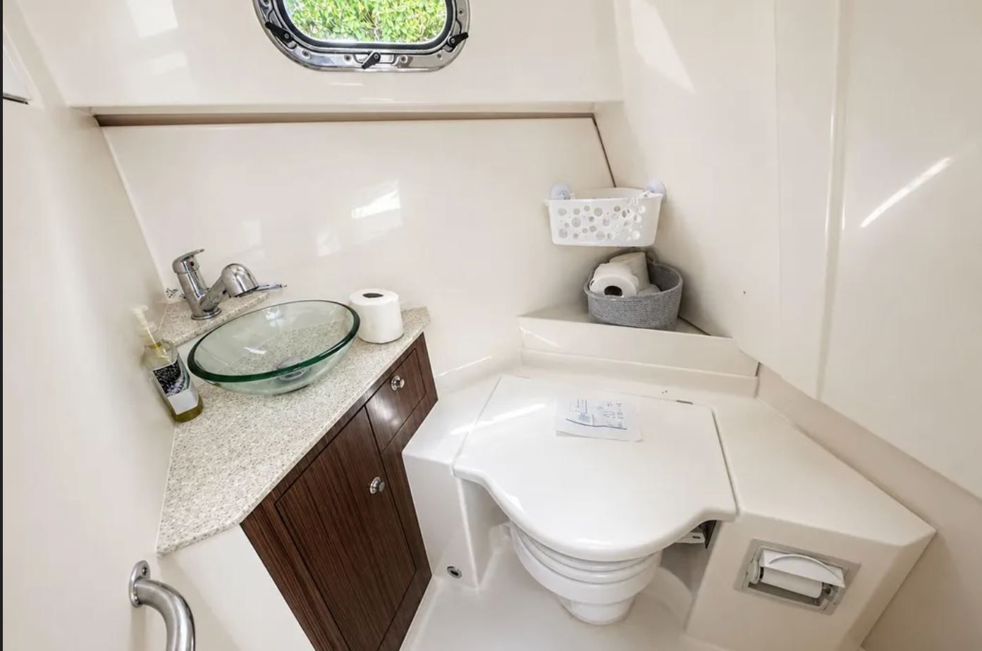 Interior of 2016 Pursuit OS 325 Offshore with sink and toilet.