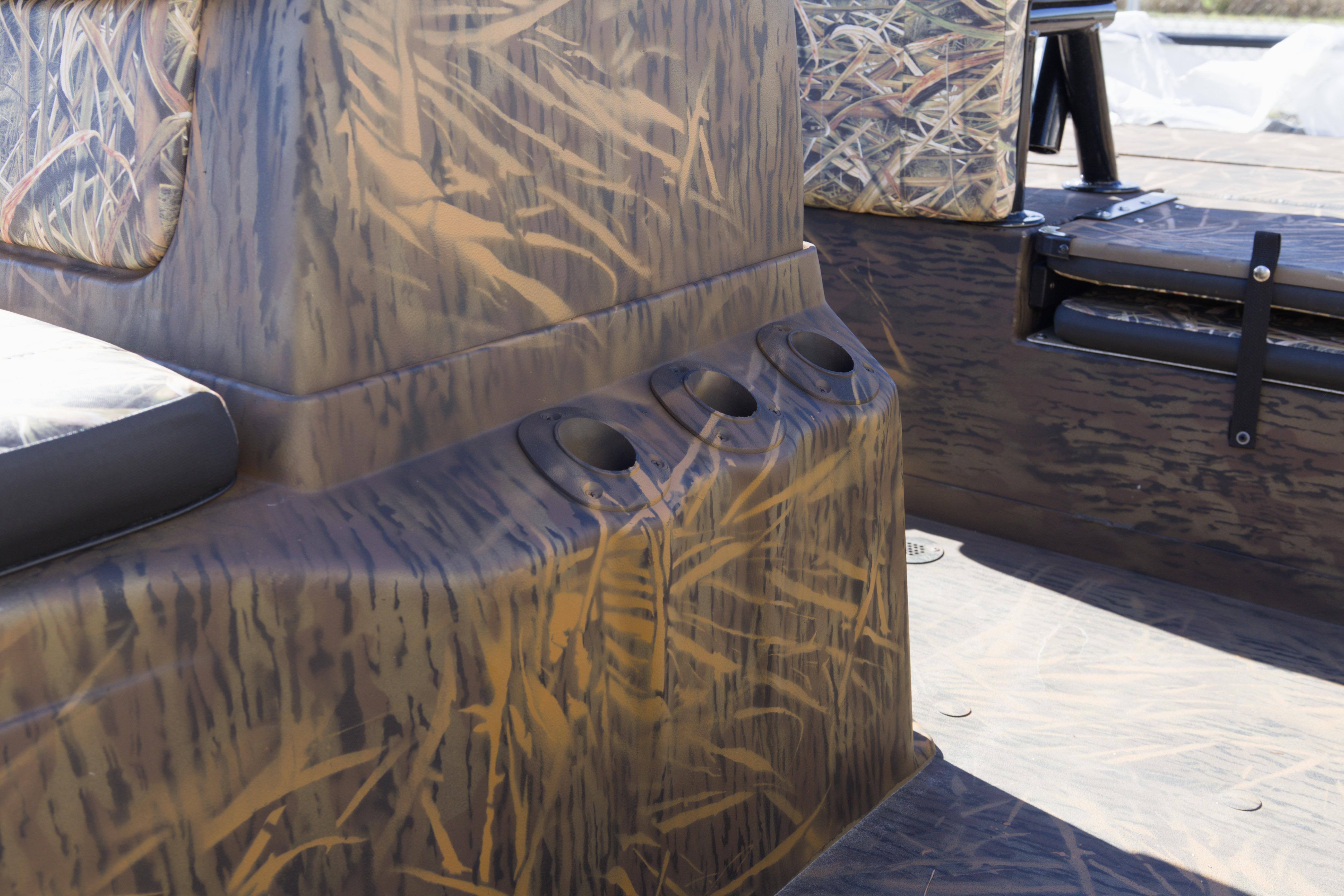 2026 G3 Gator Tough 20 CC boat interior with camouflage design and cup holders.