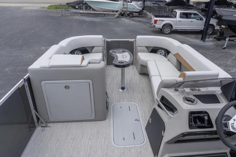 2026 SunCatcher Elite 326 SS pontoon boat interior with plush seating and modern console.