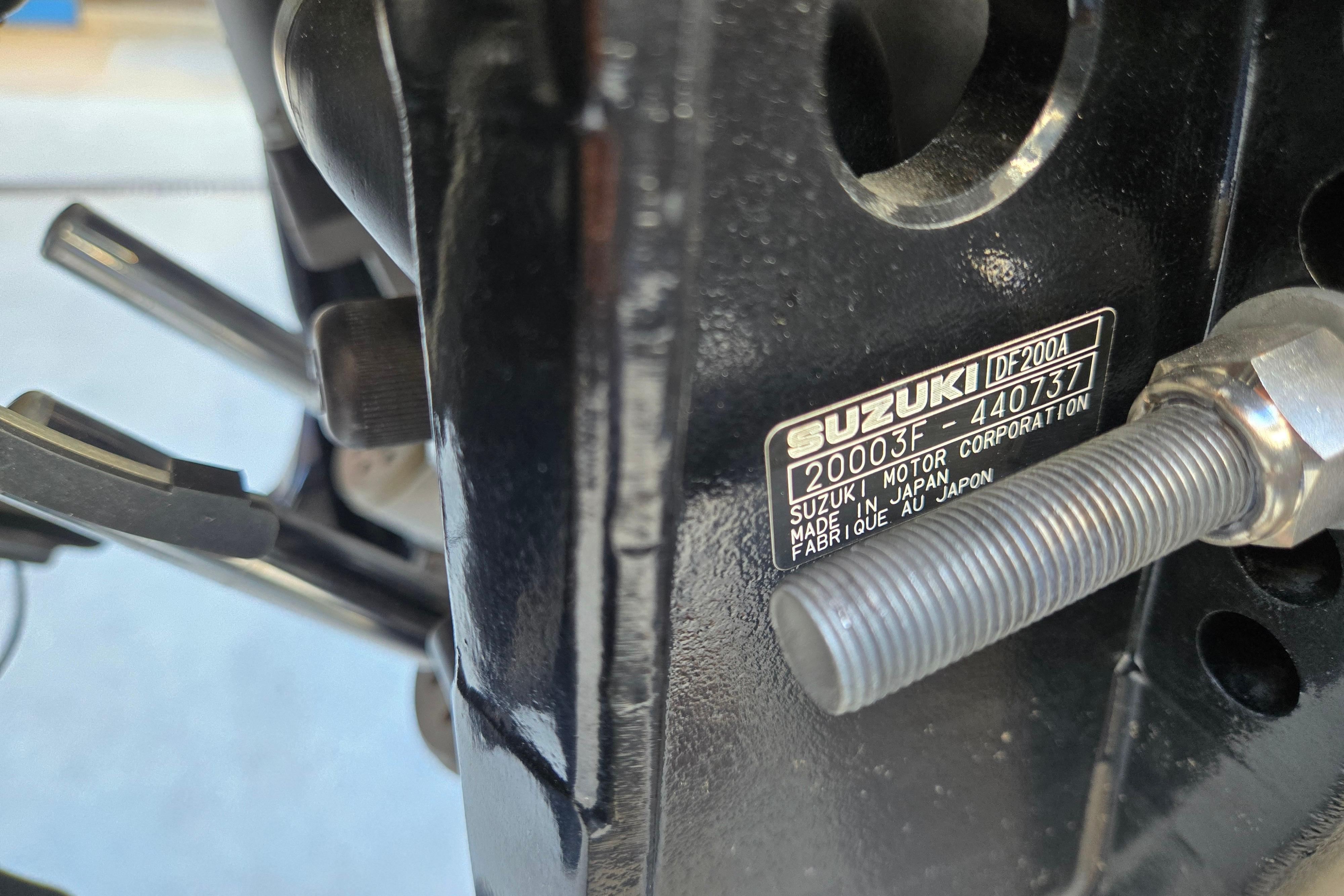 Close-up of Suzuki DF200A engine label on 2024 Godfrey Sweetwater 2486 SB boat.