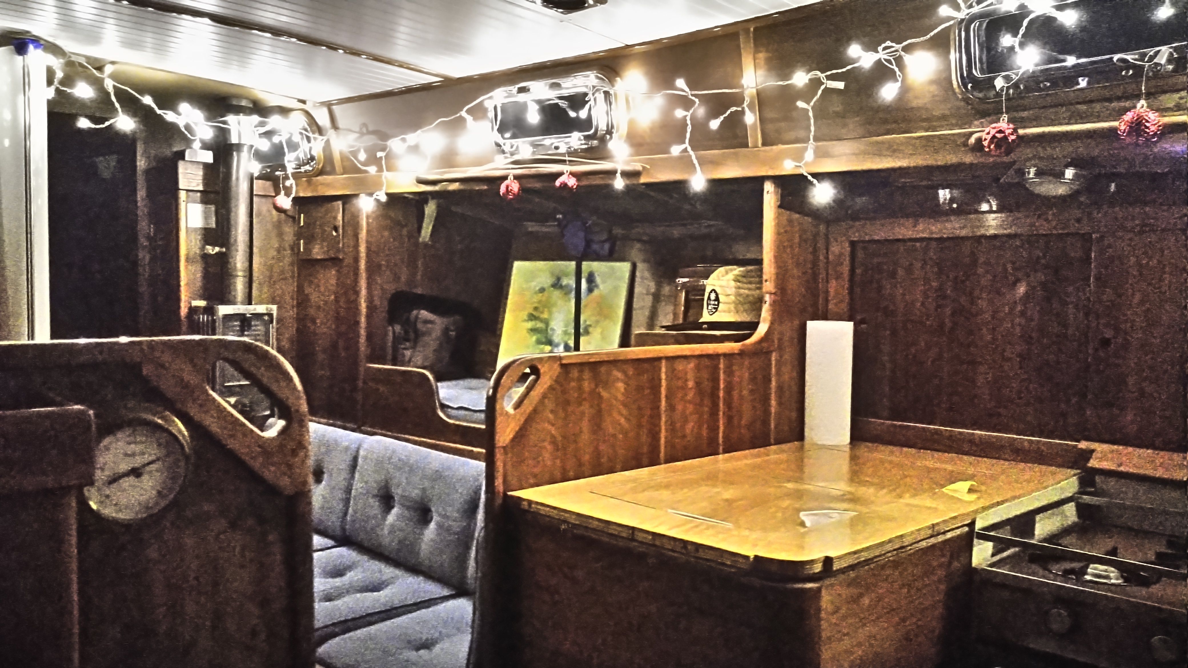 Interior of a 1978 Tartan 37 yacht with string lights.