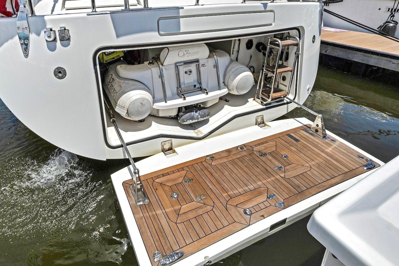 Sailing yacht Southerly 57 RS 2011 model with open stern storage and teak swim platform.