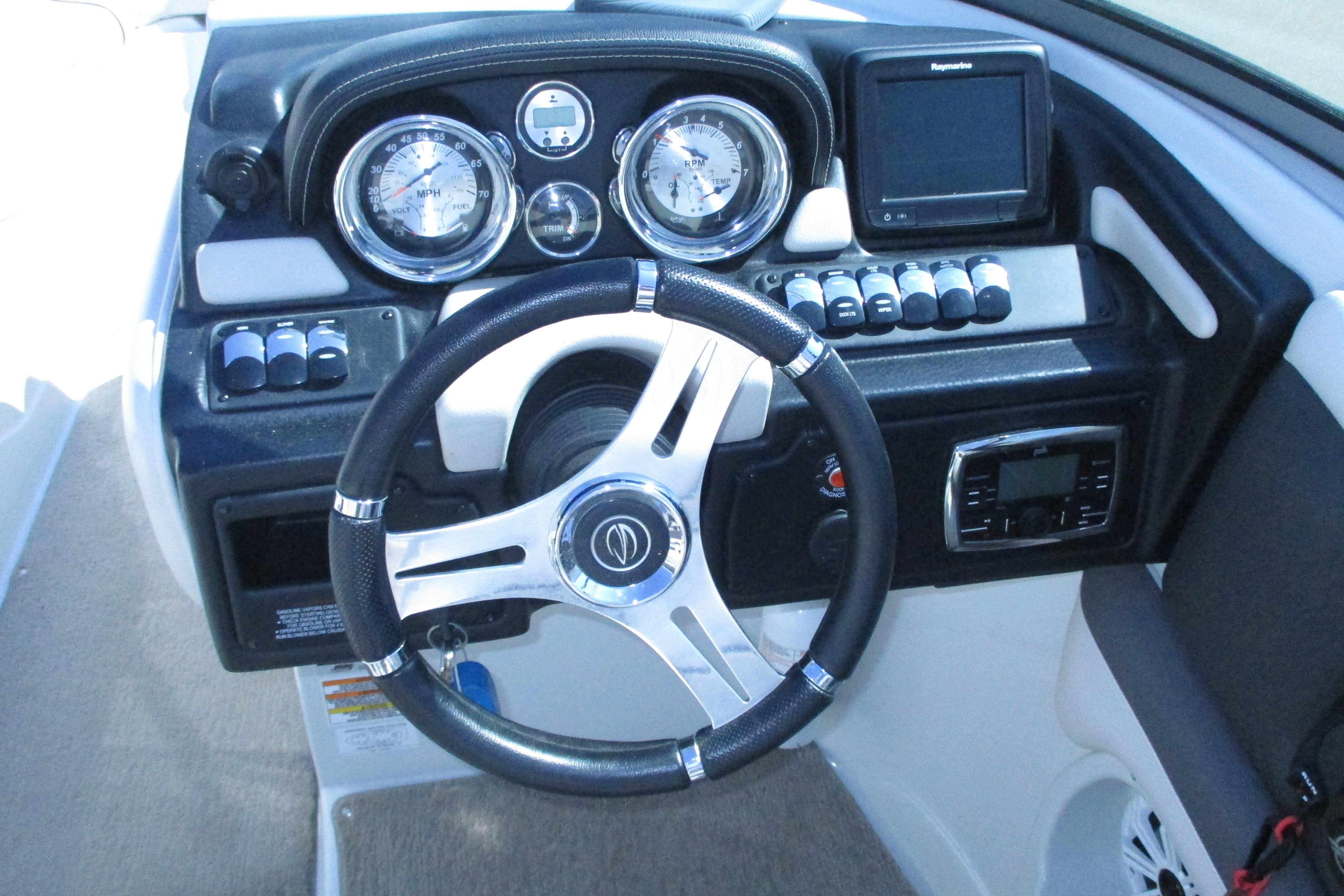 Steering console of 2017 Crownline 255 SS boat with gauges and controls.
