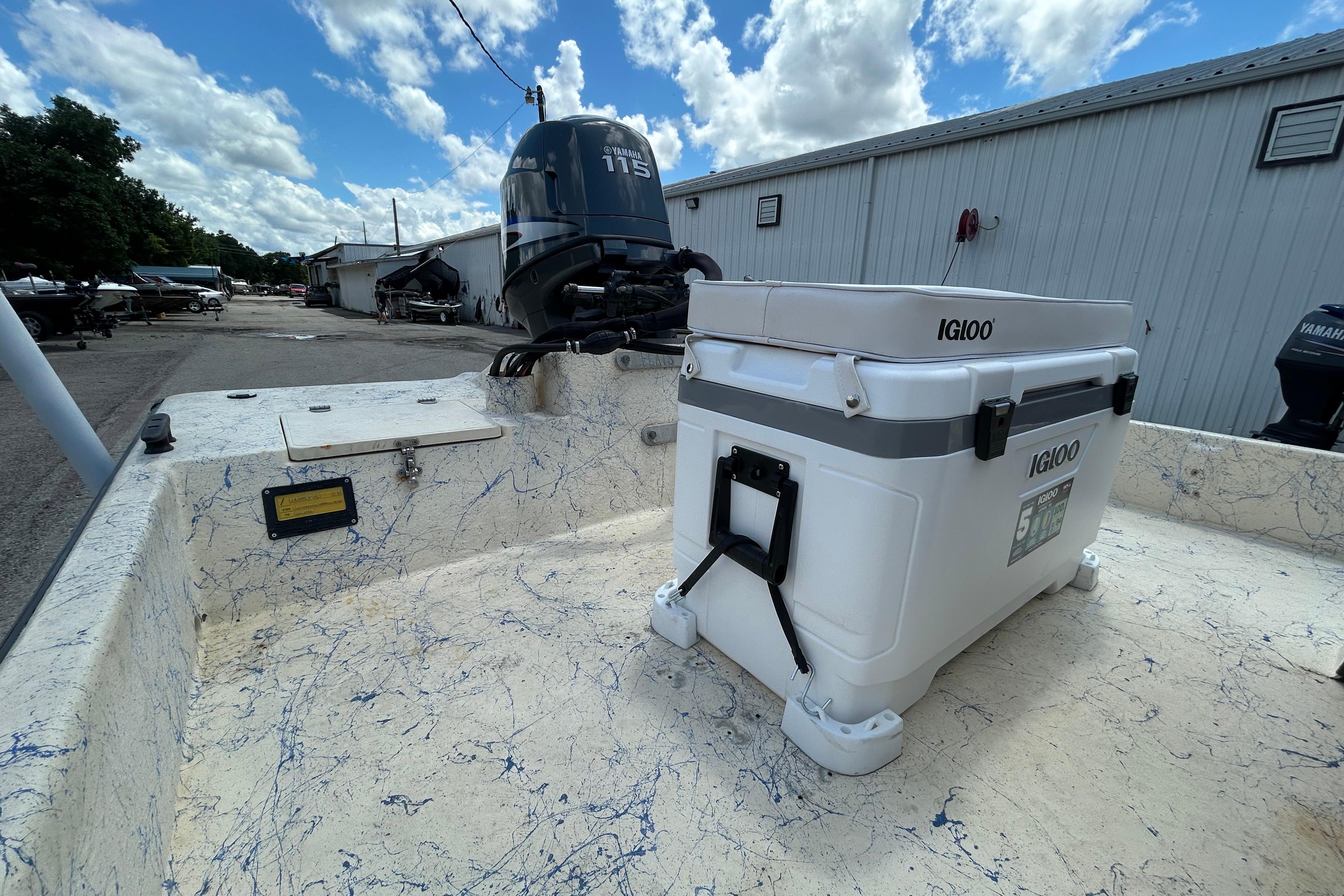 2007 Flats Cat 19 boat with Igloo cooler and Yamaha 115 outboard motor.