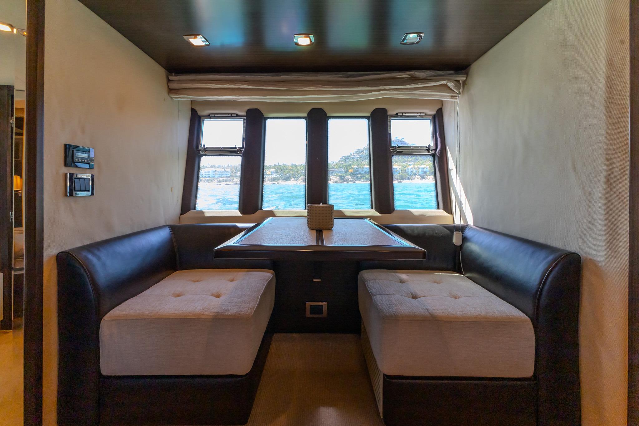Luxurious interior of 2013 Azimut Fly 72 yacht with ocean view through windows.