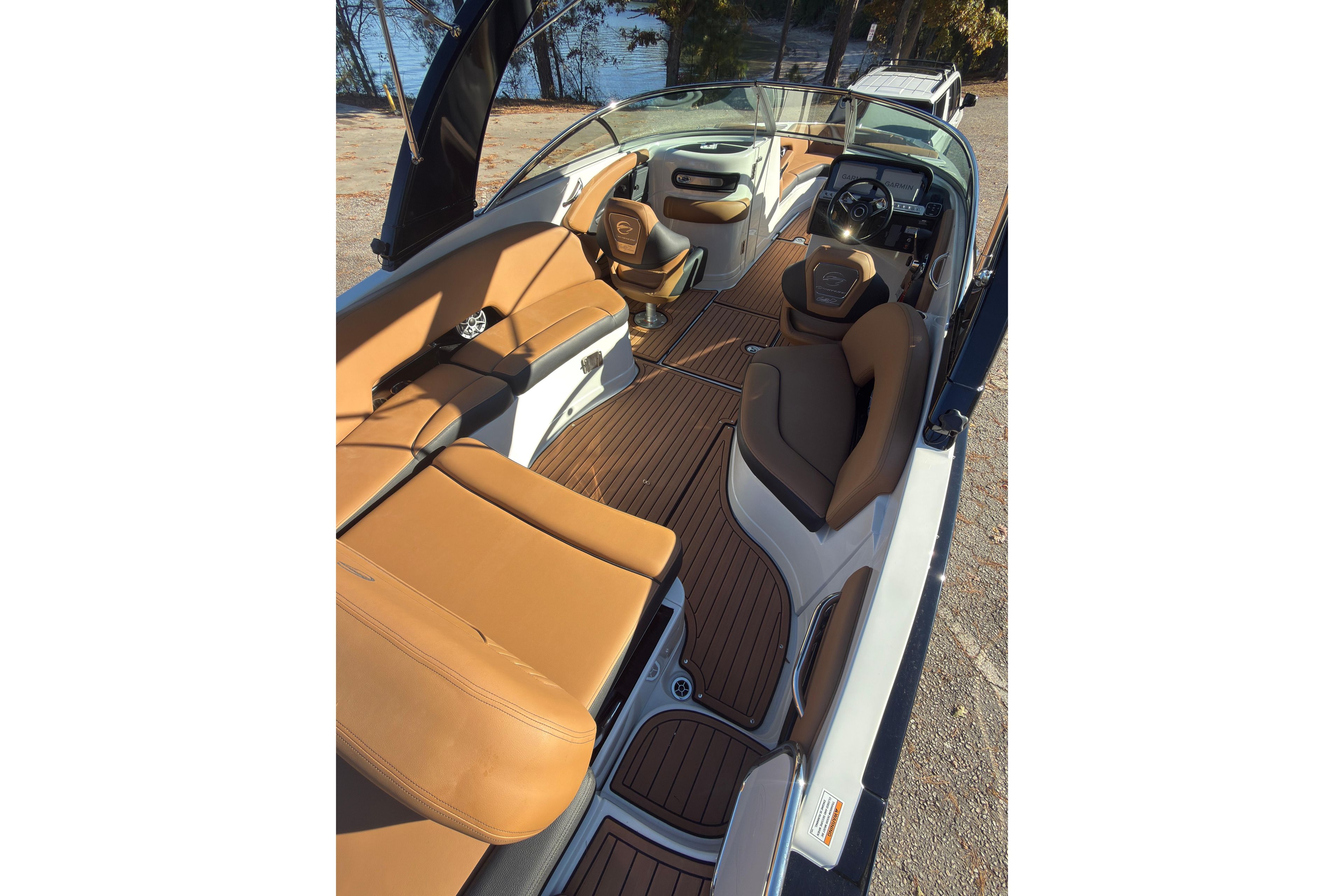 2026 Crownline 298 SS boat interior with tan leather seating and sleek design.