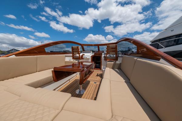 Vento V40 Retro Classic Open 2023 yacht interior with beige seating and wooden accents.
