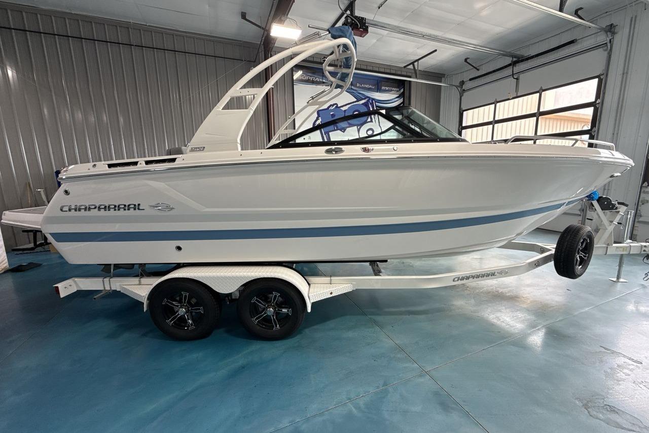 A 2026 Chaparral SSX 4 on a trailer inside a garage.