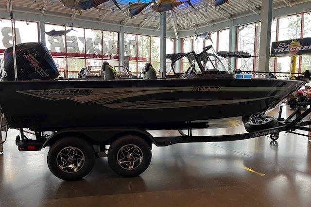 2026 Ranger VX1888 WT boat displayed indoors with dual-axle trailer.