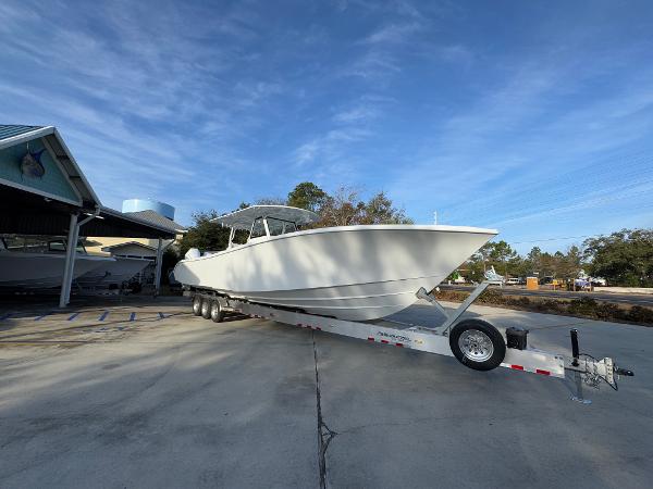 2025 Yellowfin 39 Offshore boat on trailer, parked outdoors under clear sky.