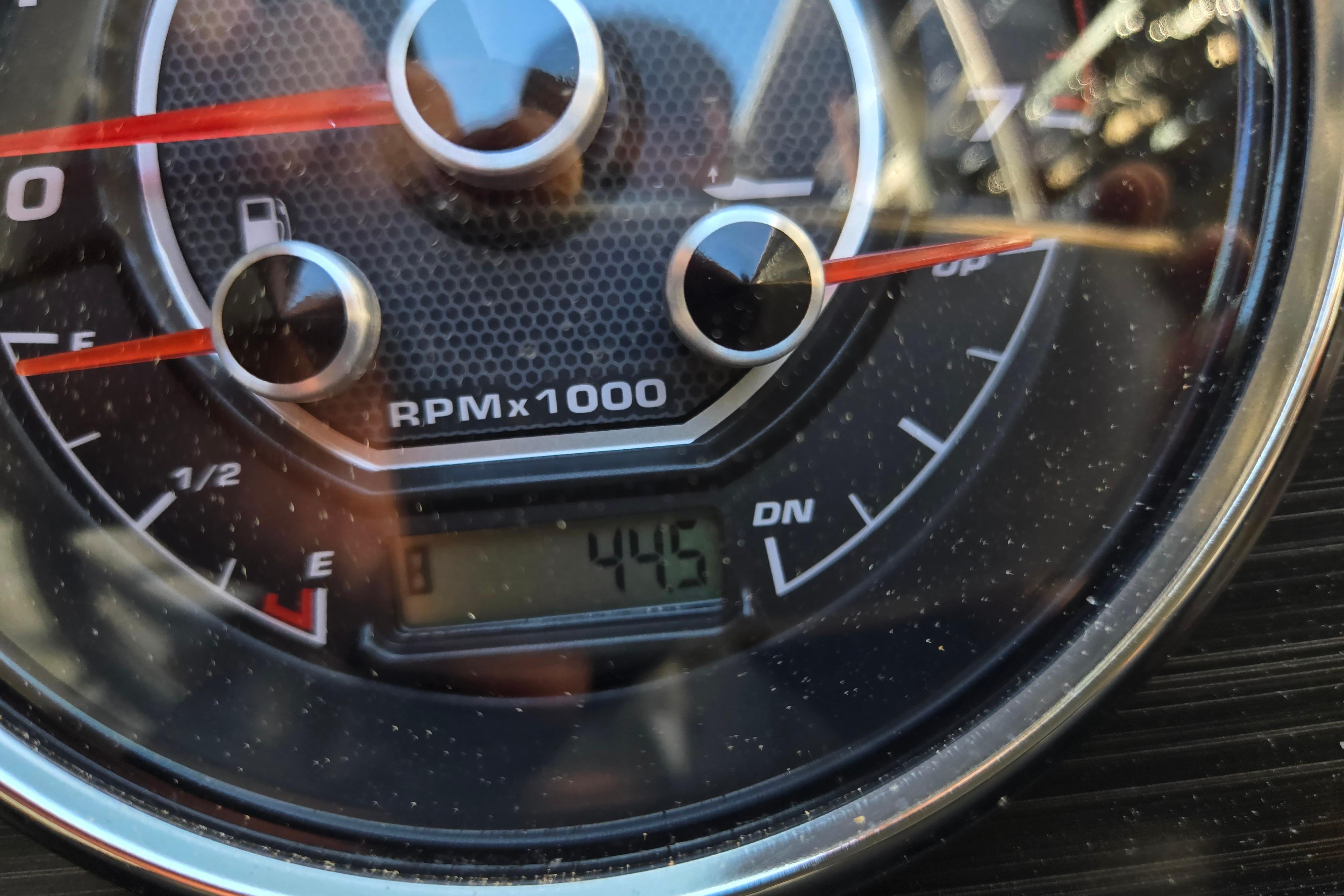 Close-up of 2024 Godfrey Sweetwater 2486 SB tachometer displaying RPM and fuel gauge.