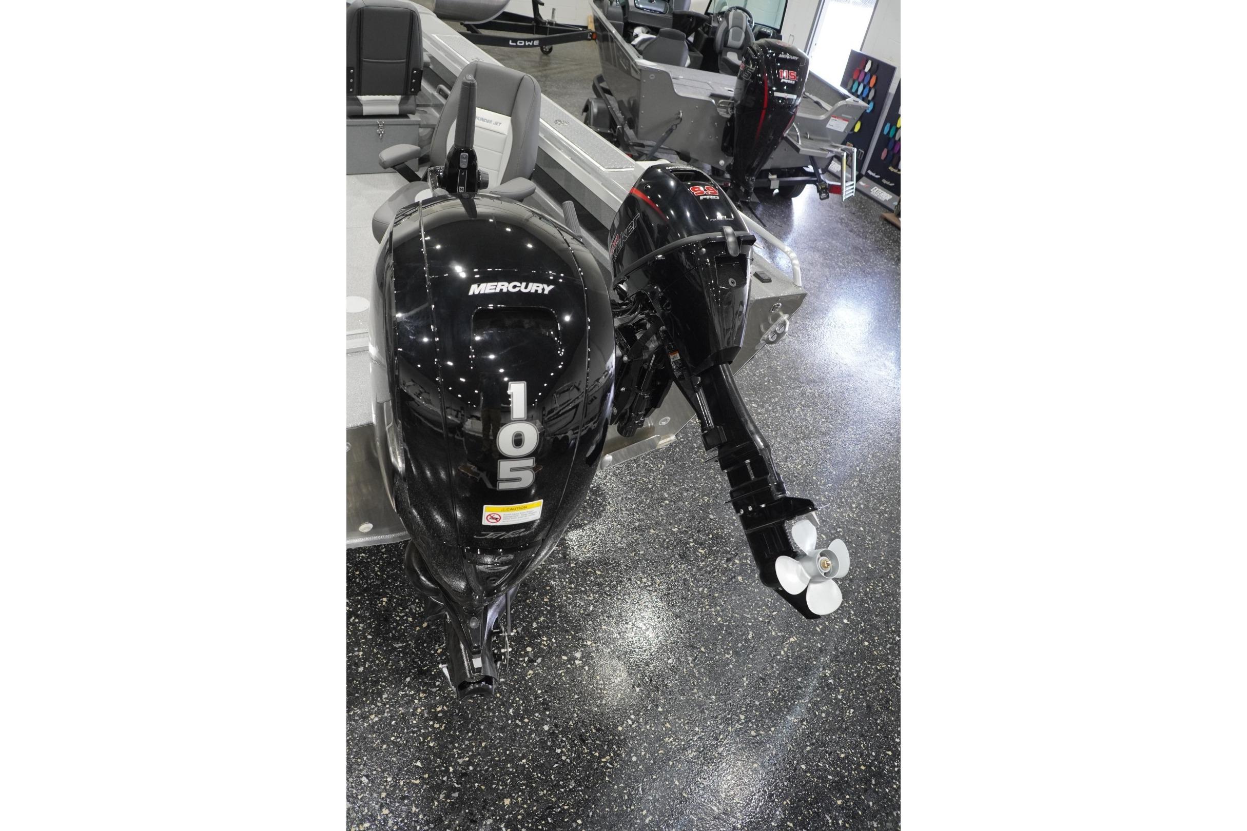 2026 Thunder Jet 209 Rush OT boat with Mercury 105 outboard motor in showroom.