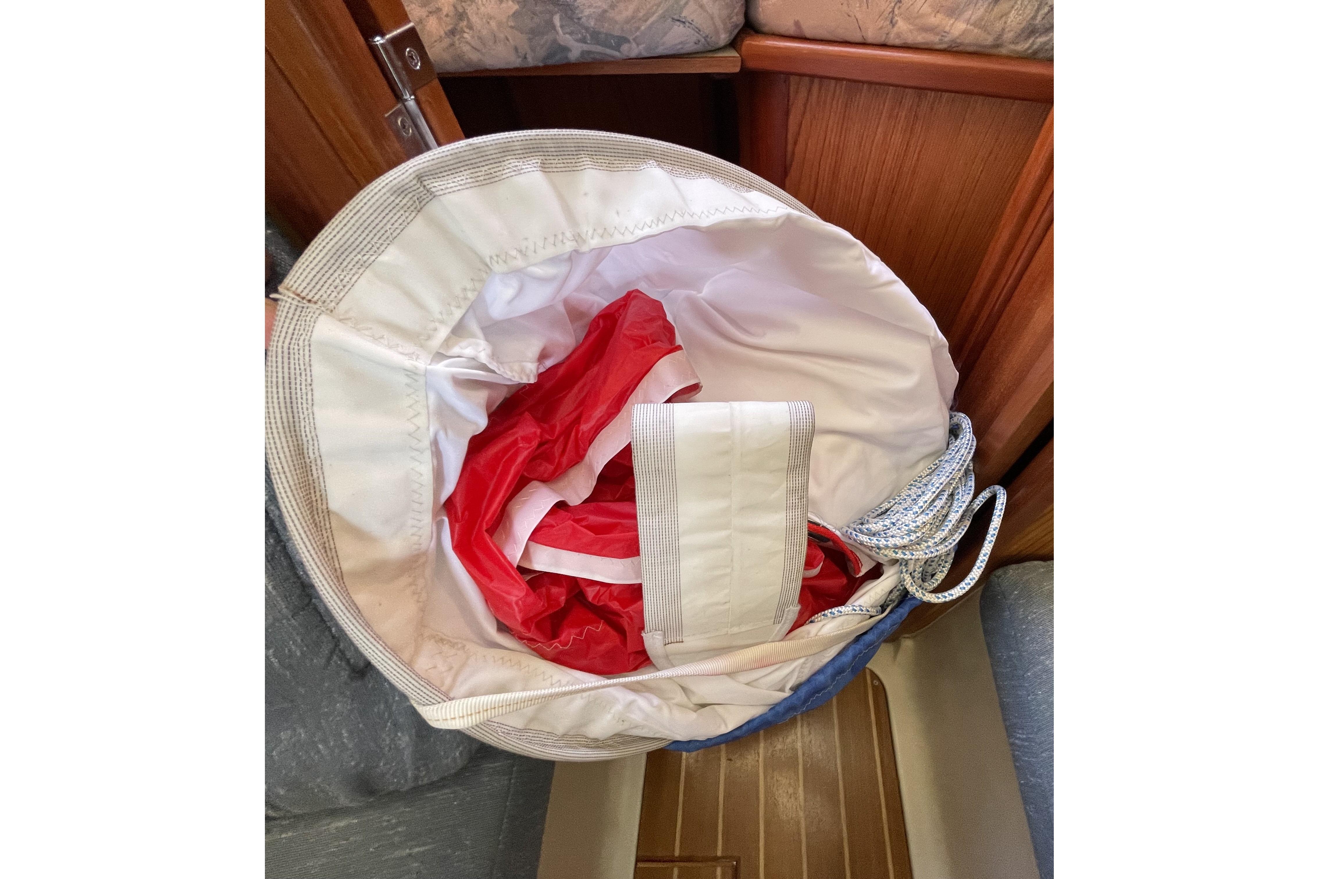 Sailboat interior with red sail in a bag, Hunter 340 model, year 2000.