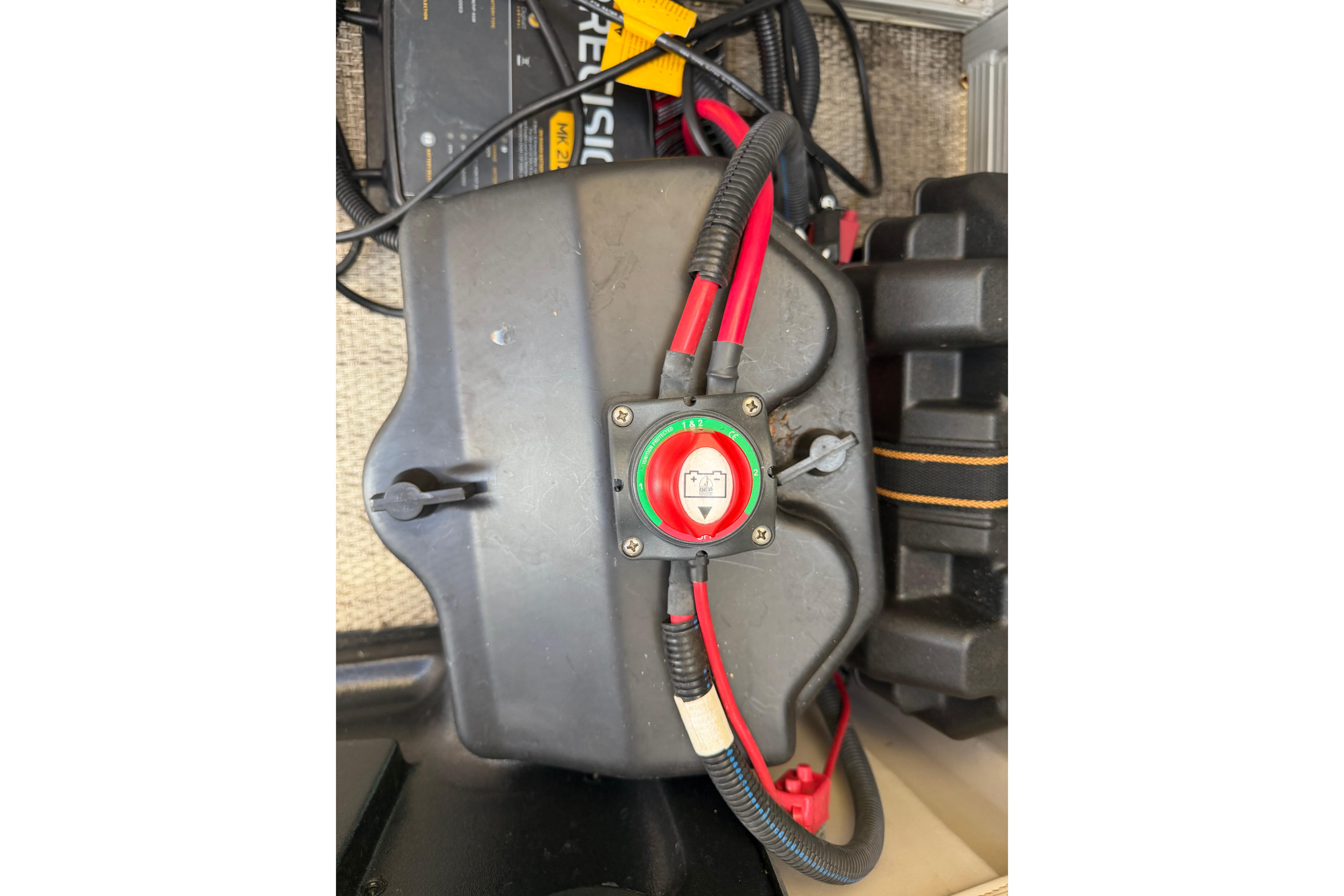 Battery compartment of a 2018 Bennington 21 SF boat with wiring connections.