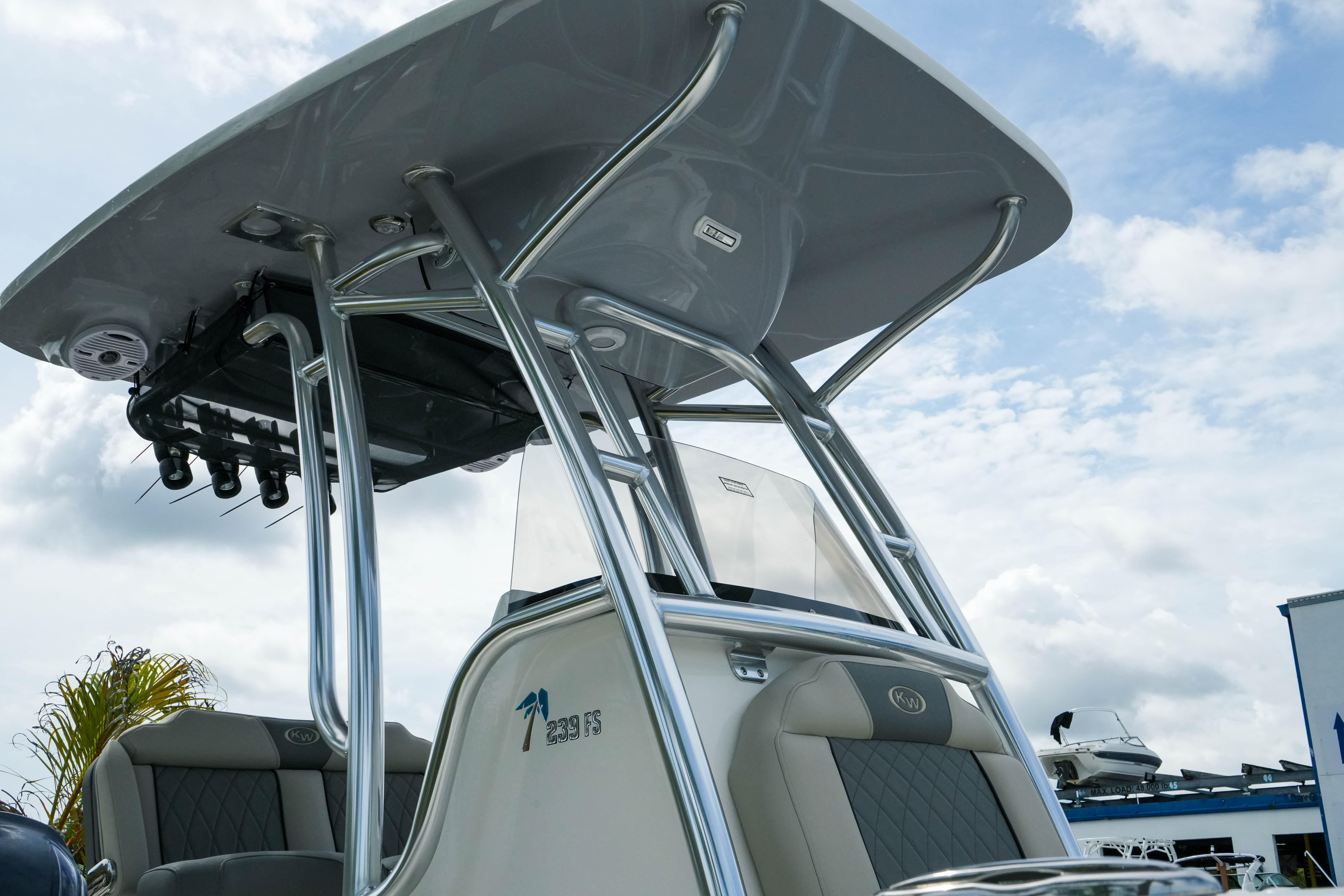 2026 Key West 239 FS boat with sleek design and sturdy T-top under a cloudy sky.