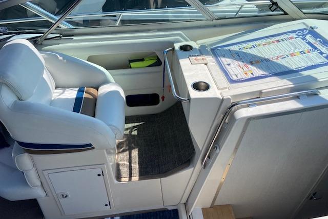 1994 Cruisers Yachts 3675 Esprit cockpit with white seating and control panel.