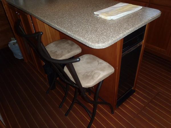 Great Harbour N40 2025 yacht interior with bar stools and countertop.