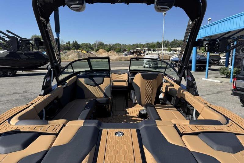 2026 MasterCraft XT22 boat interior with tan and black seating, showcasing luxury design.