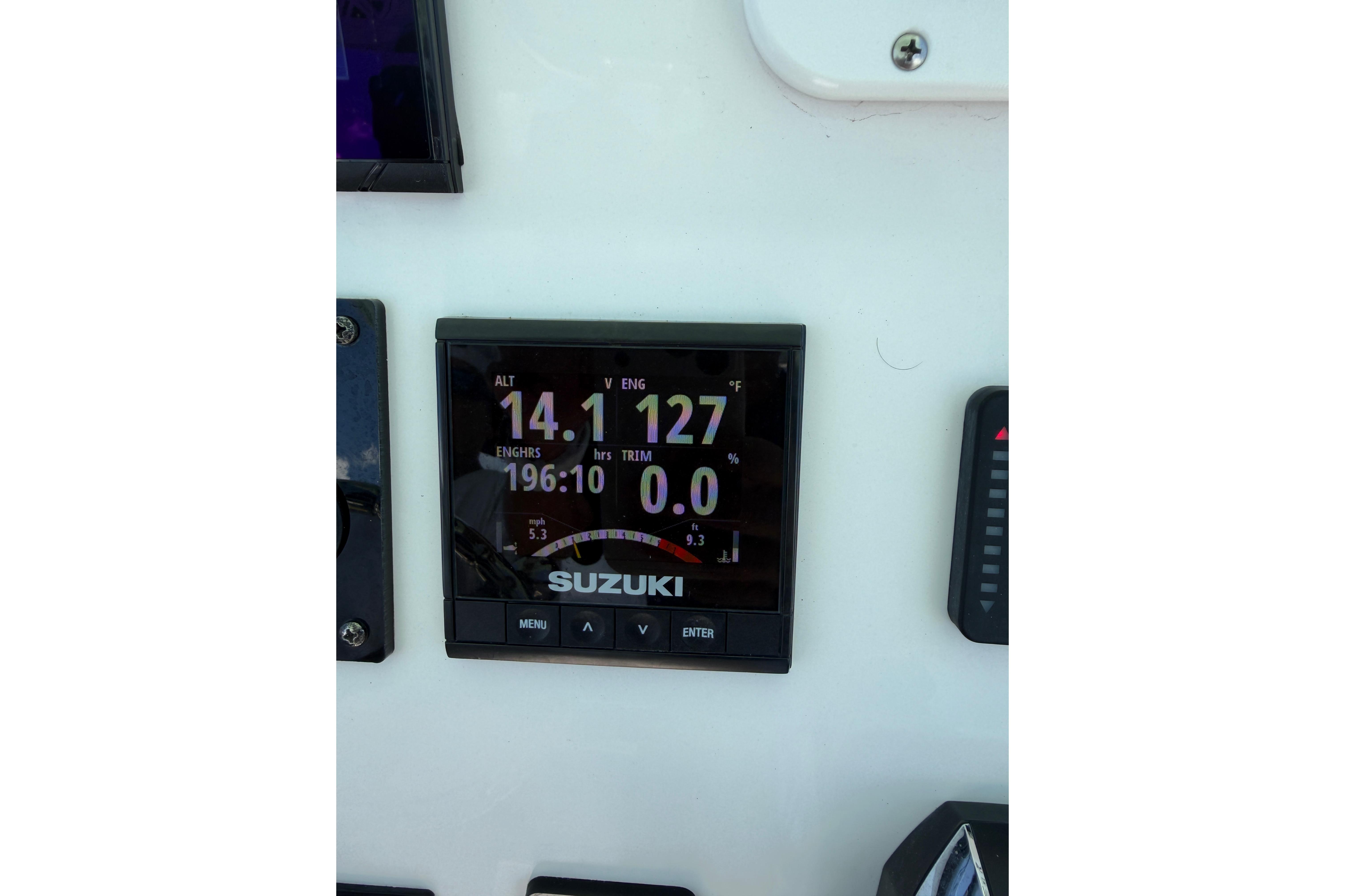 Suzuki engine display on 2022 Aquasport 230 Pro Bay boat dashboard.