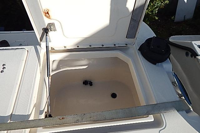 Open storage compartment on a 2003 World Cat 270 EC boat.