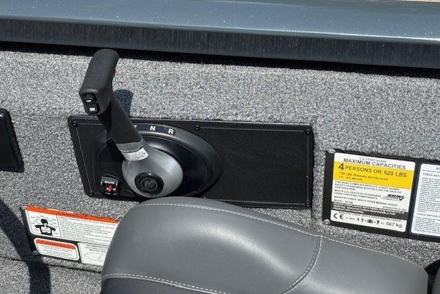 Control panel of 2026 Ranger RT188 boat with capacity label and throttle lever.