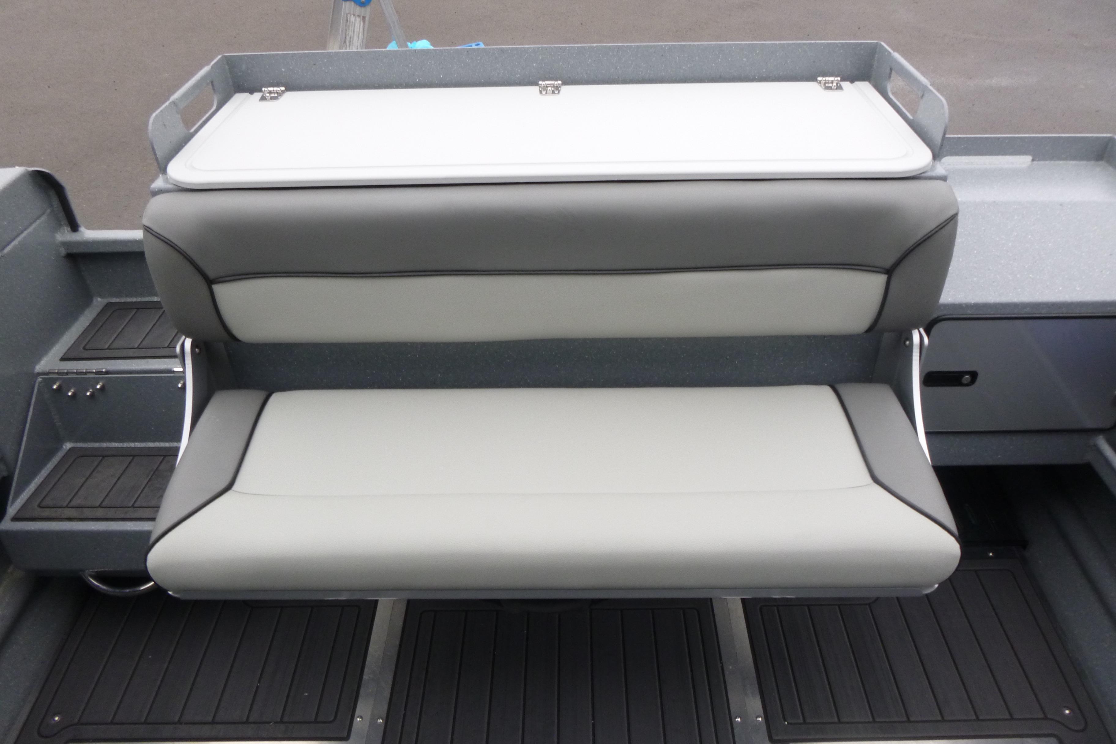 KingFisher 25 XAC 2026 boat seating with gray and white cushioned bench.