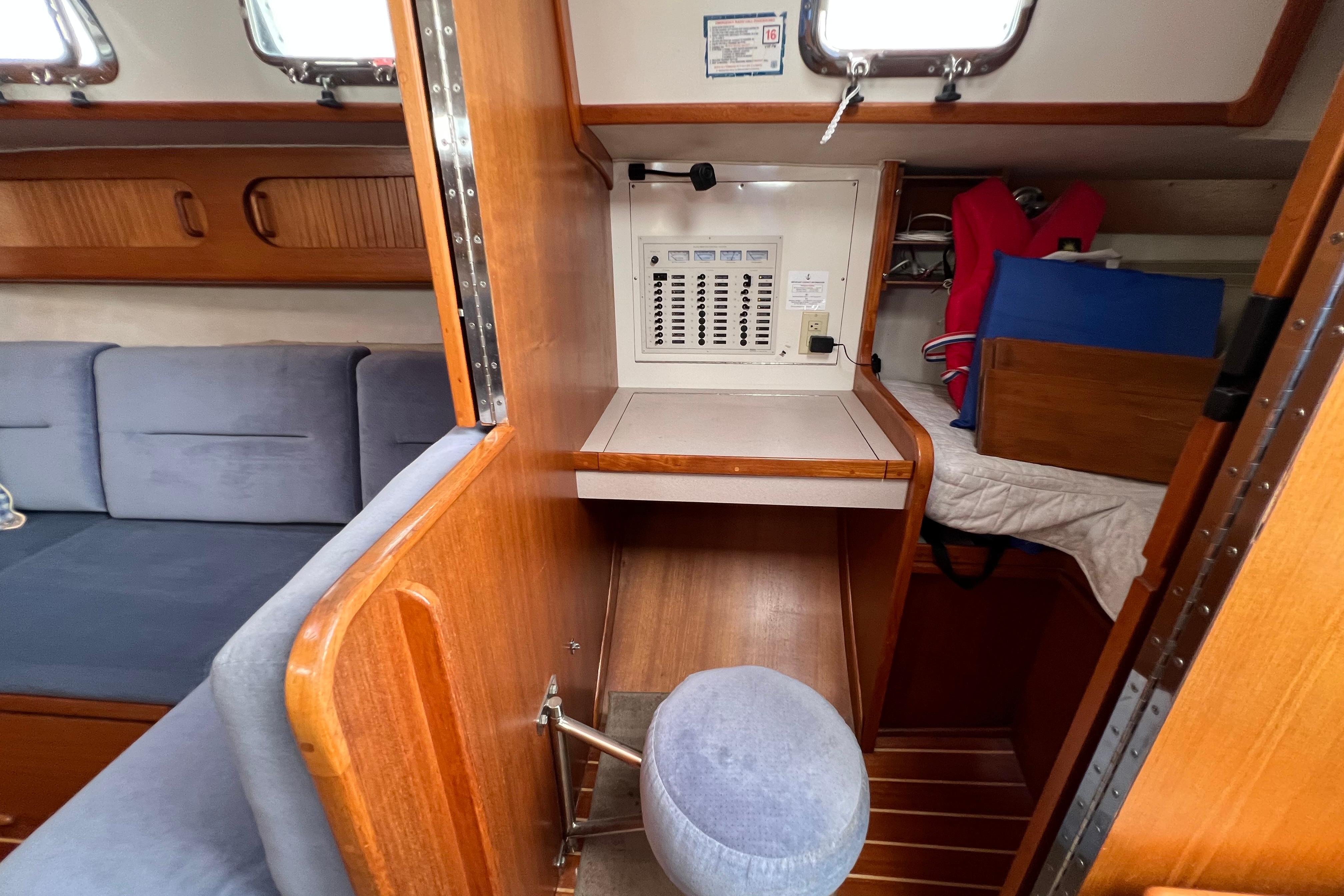1996 Caliber 35 LRC yacht interior with navigation station and seating area.