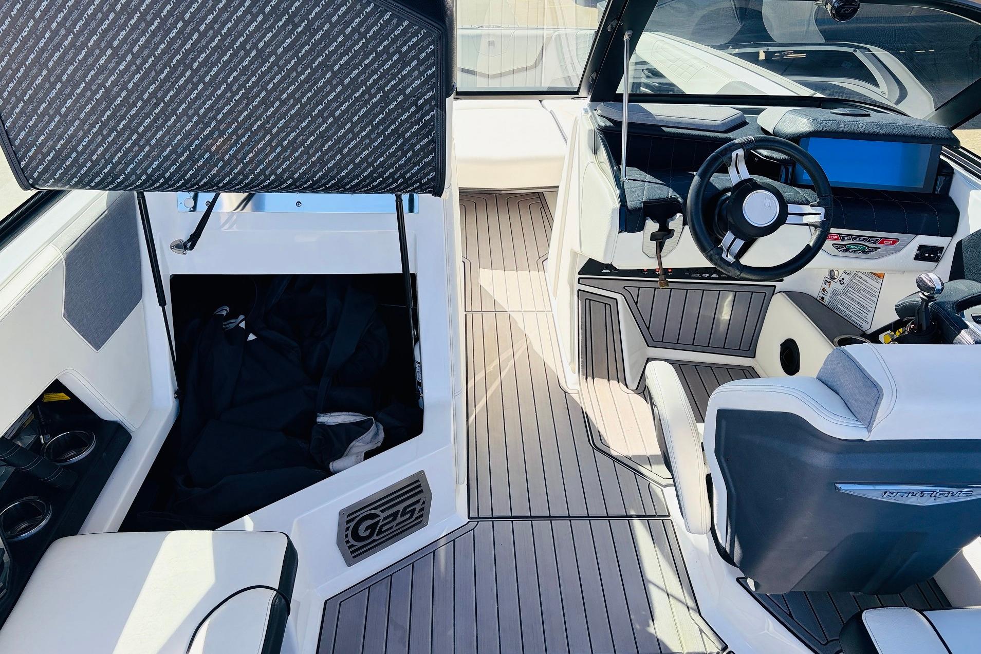 2023 Nautique Super Air Nautique G25 interior with modern helm and seating.