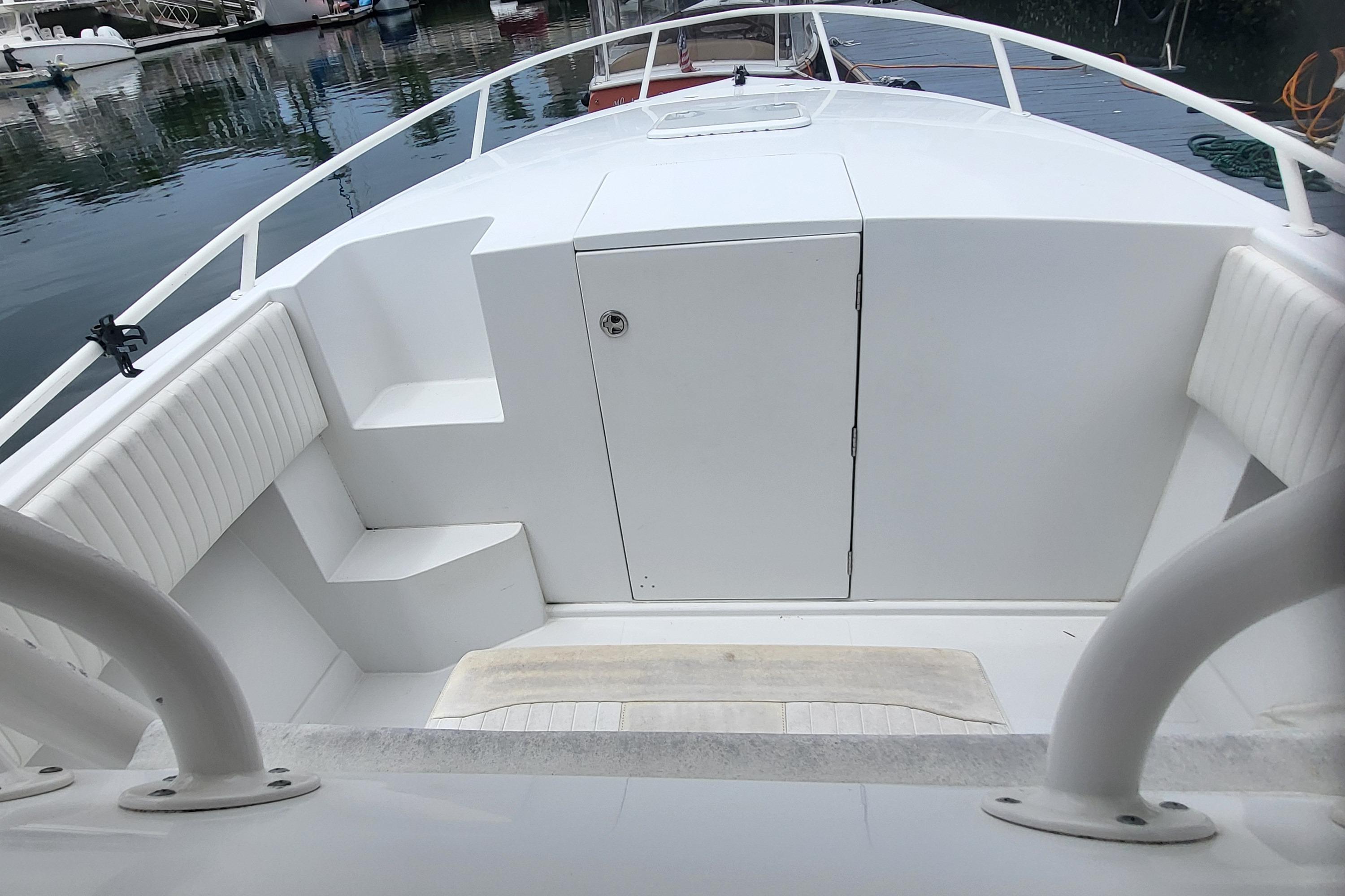2004 Jupiter 31 Center Console boat, foredeck view in harbor.