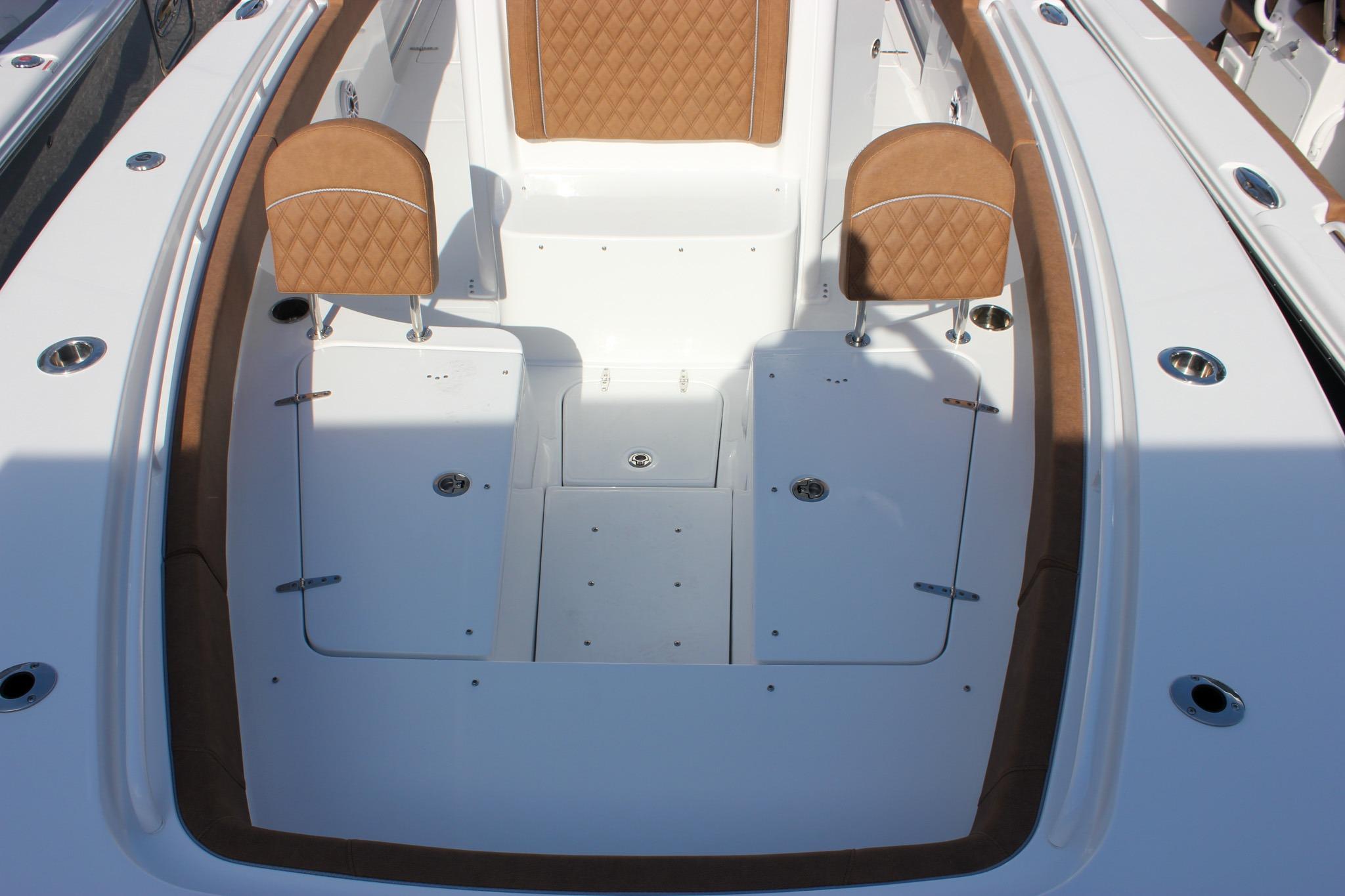 2027 Sea Hunt Ultra 275 SE boat interior with tan seating and white deck.