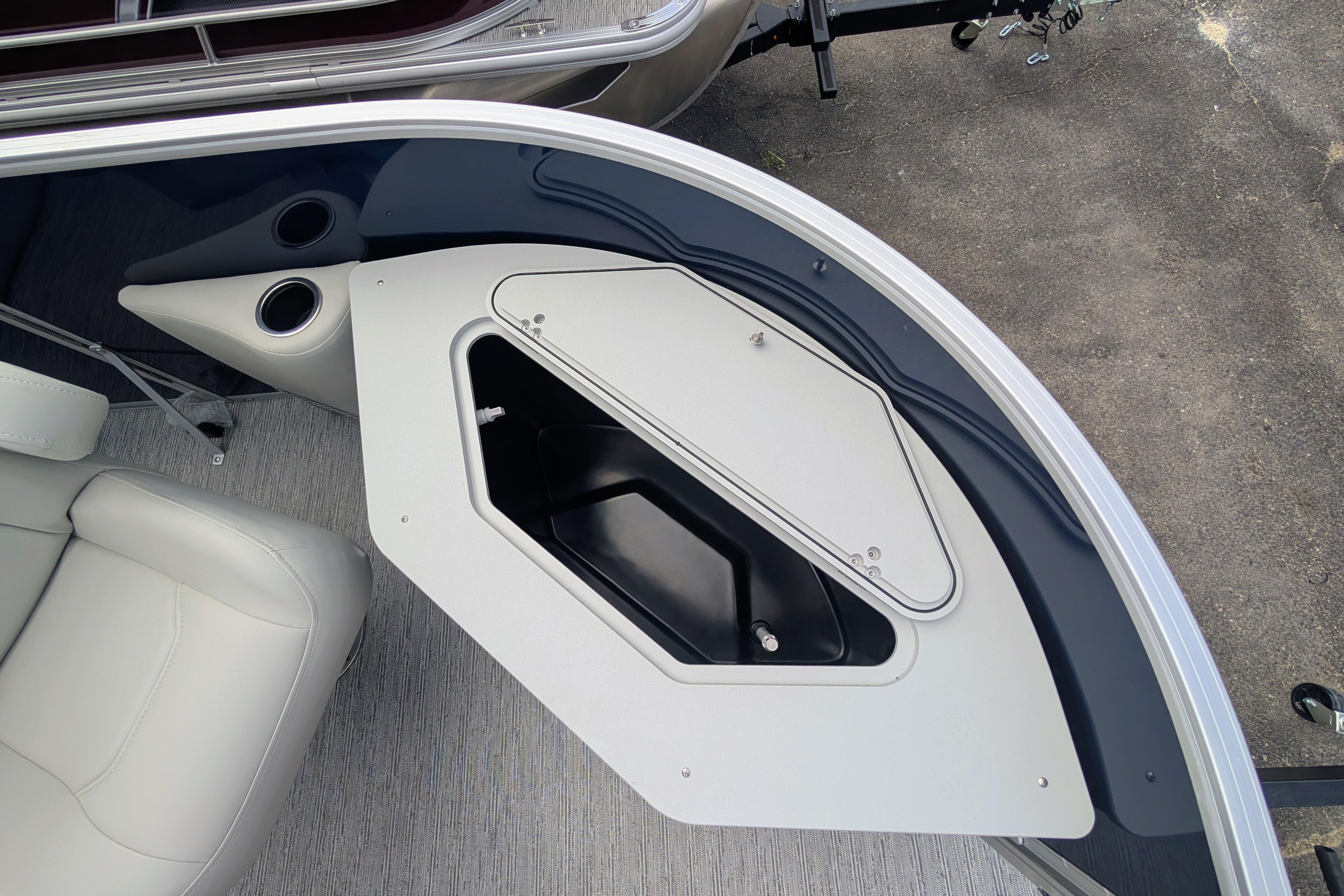 2026 Starcraft EX 20 F boat interior with storage compartment and seating.