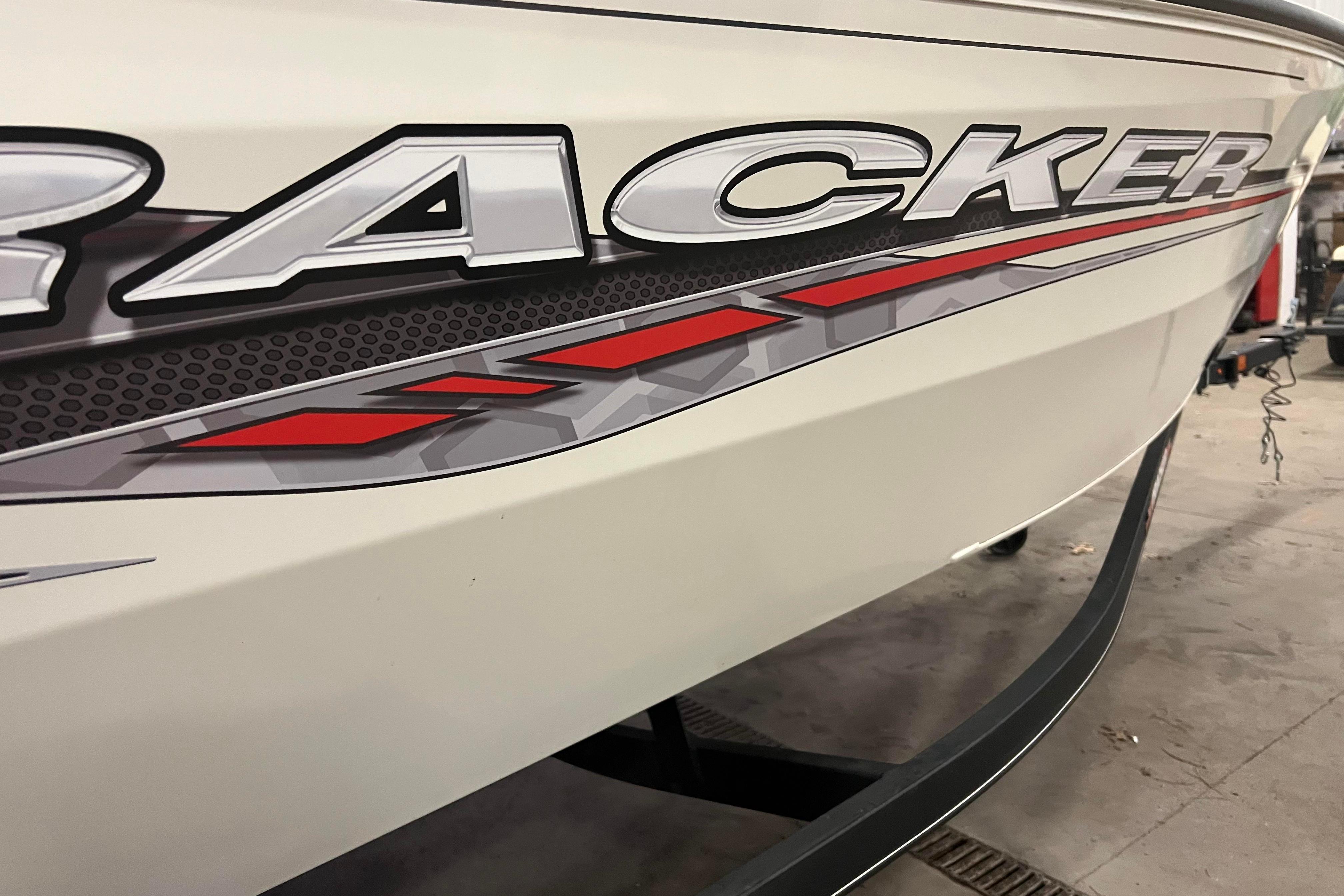 2022 Tracker Pro Guide V-16 WT boat with bold graphics and sleek design.