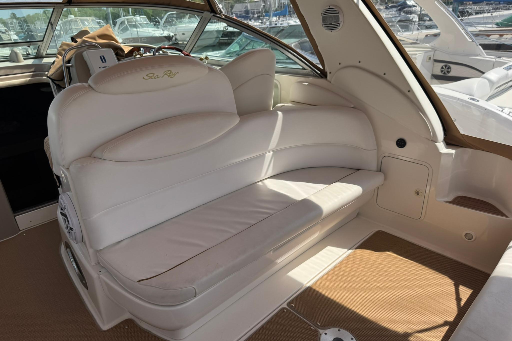 Interior of a 2001 Sea Ray 340 Sundancer boat with white leather seating.