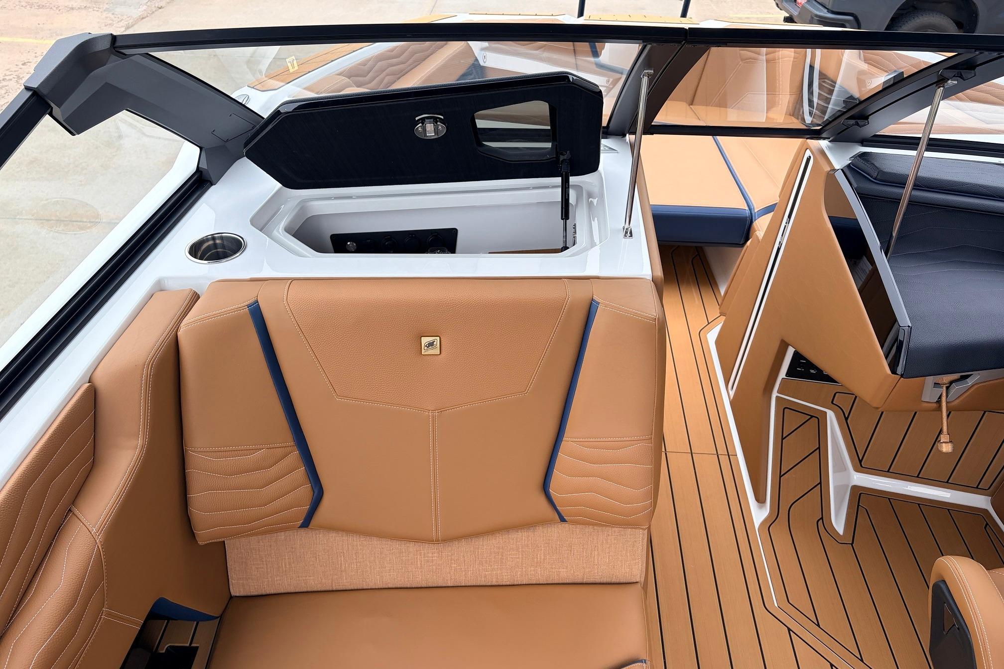 2026 Nautique Super Air Nautique G25 interior with tan seating and sleek design.