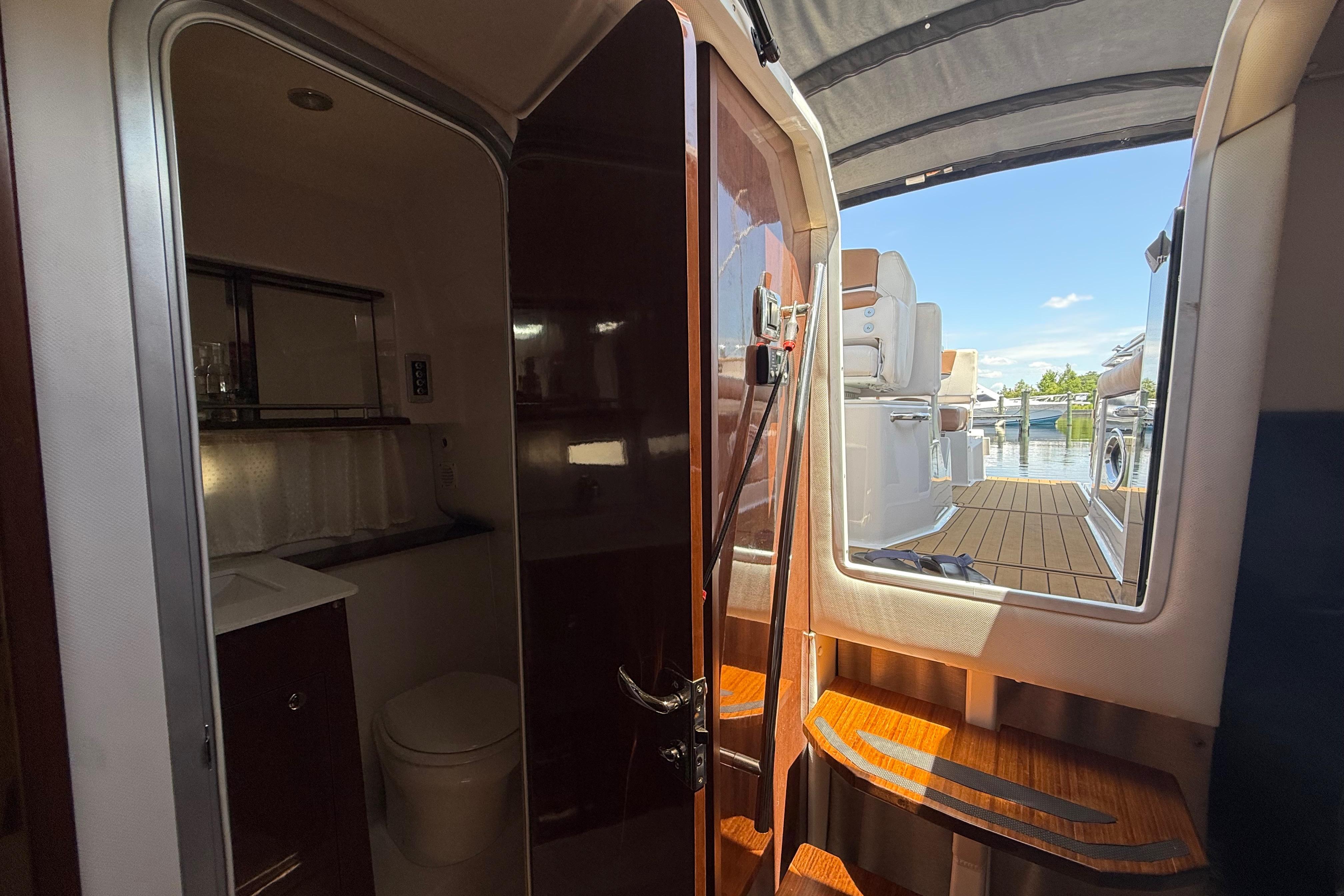 Interior view of 2017 Four Winns V275 boat, showing cabin and deck access.