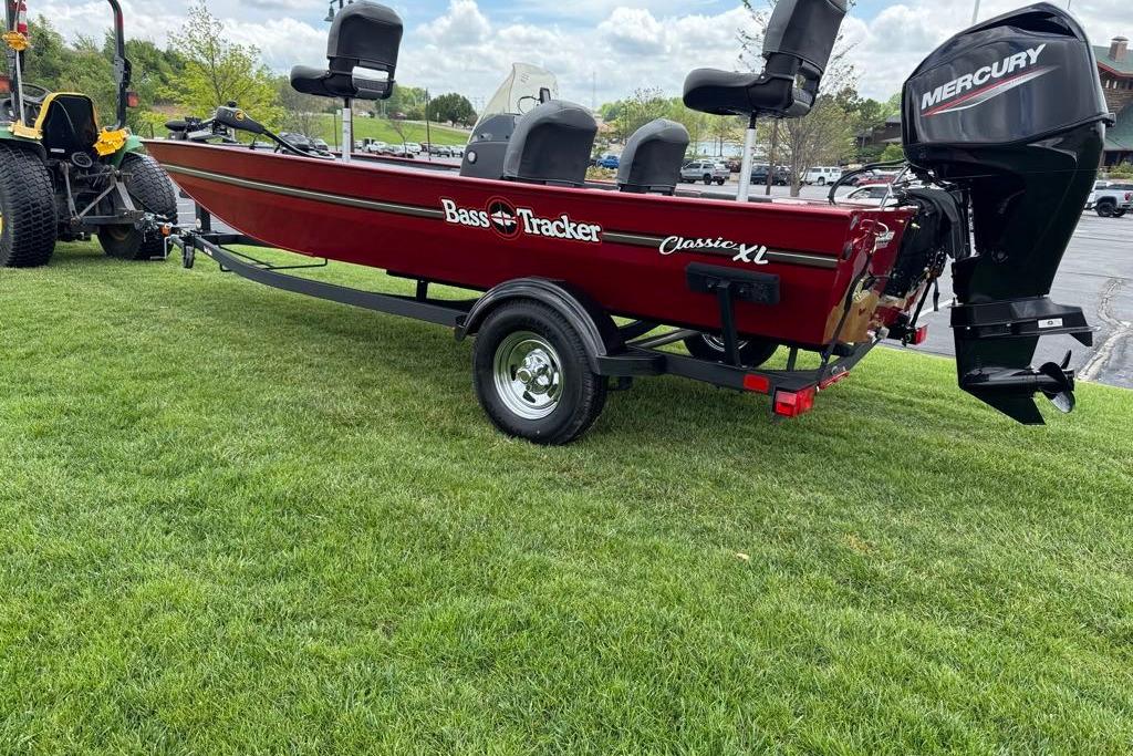 2026 Tracker Bass Tracker Classic XL boat on trailer, parked on grass.