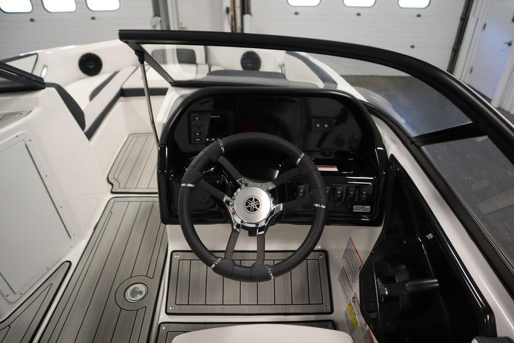 2026 Yamaha Boats 195S cockpit with steering wheel and control panel.