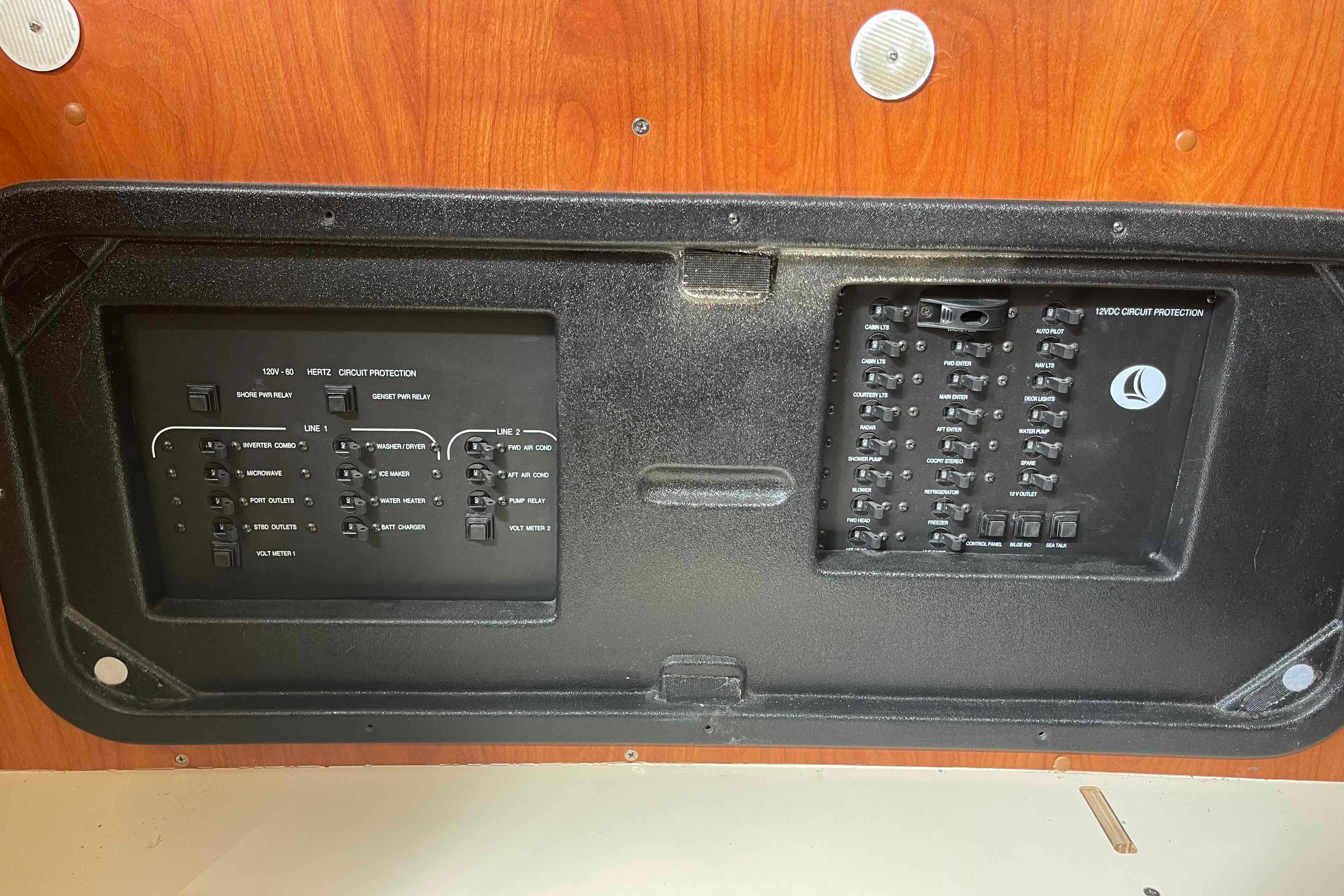 Electrical panel of a 2010 Hunter 45 Center Cockpit sailboat, featuring circuit protection switches.