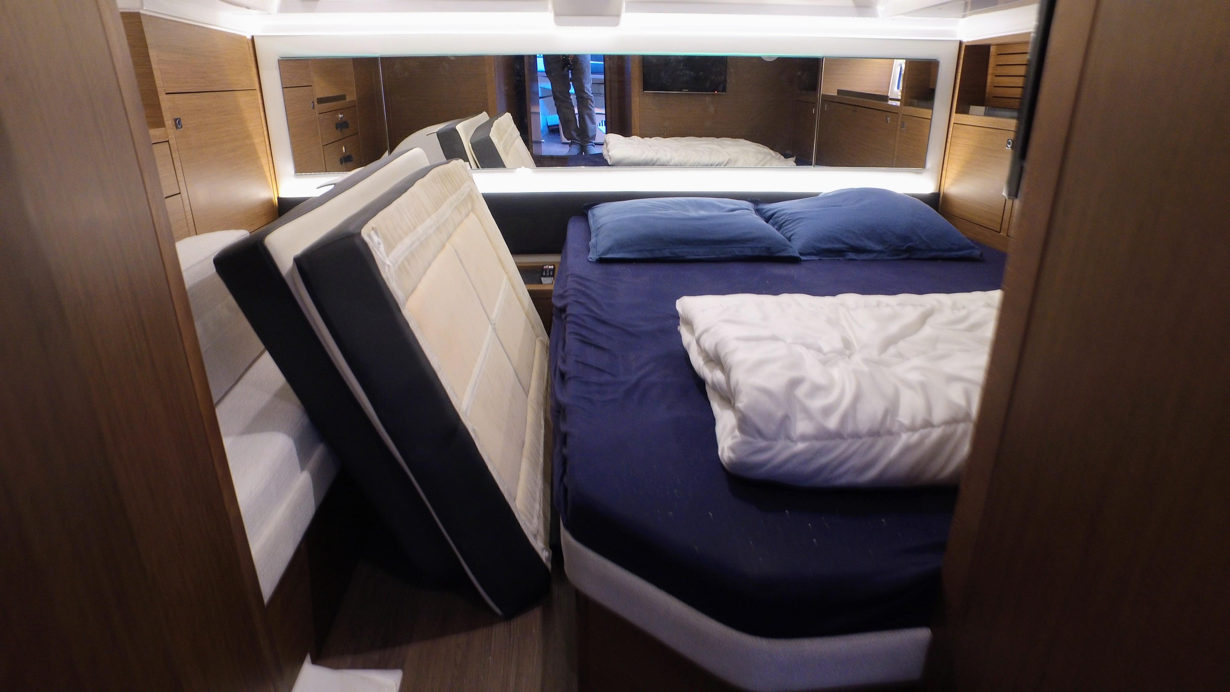 Luxurious cabin interior of 2023 Jeanneau CAP CAMARAT 12.5 WA with cozy bedding.